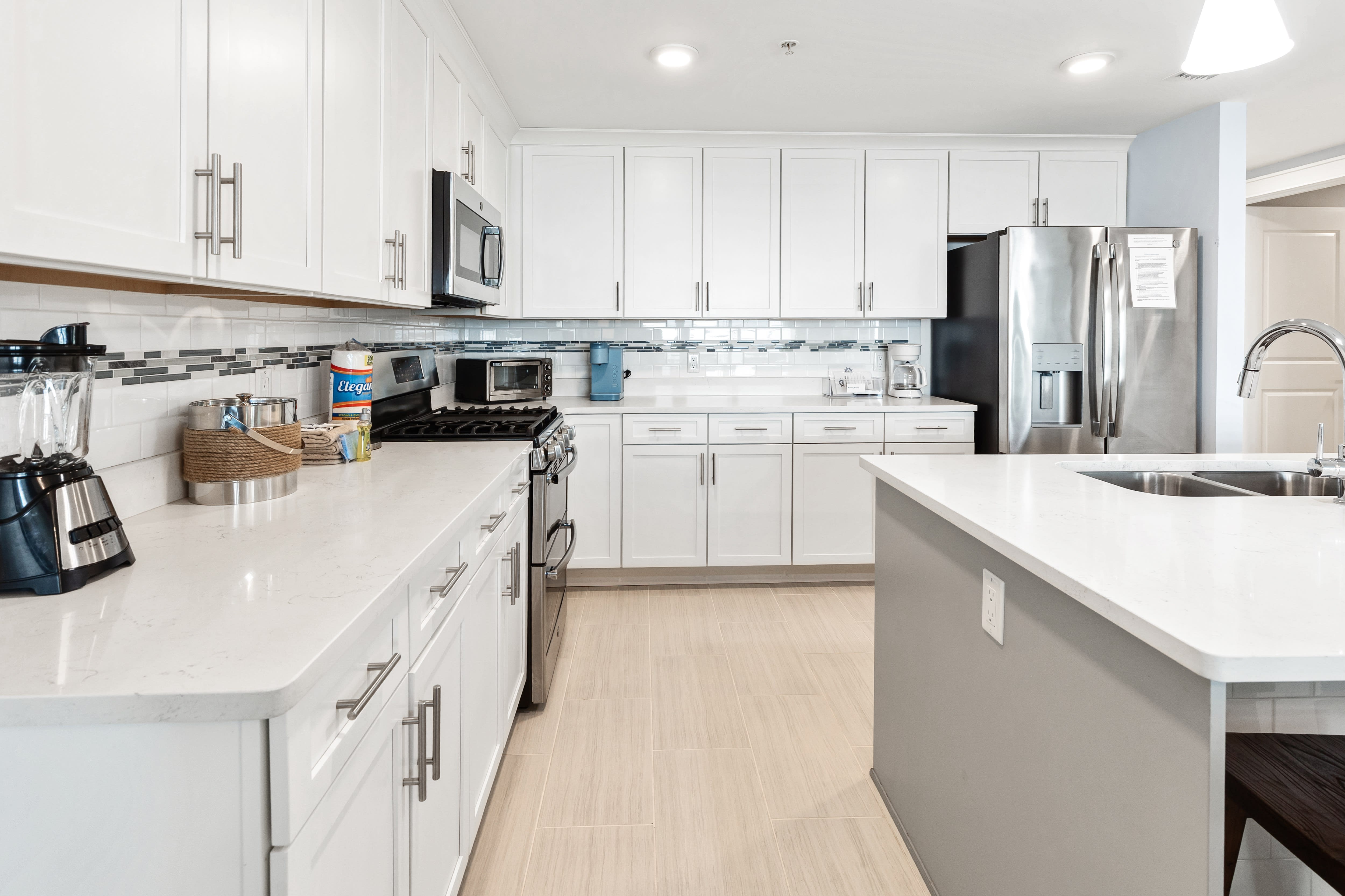 Cook your favorite meals in this bright, modern kitchen with stainless steel appliances and plenty of counter space.