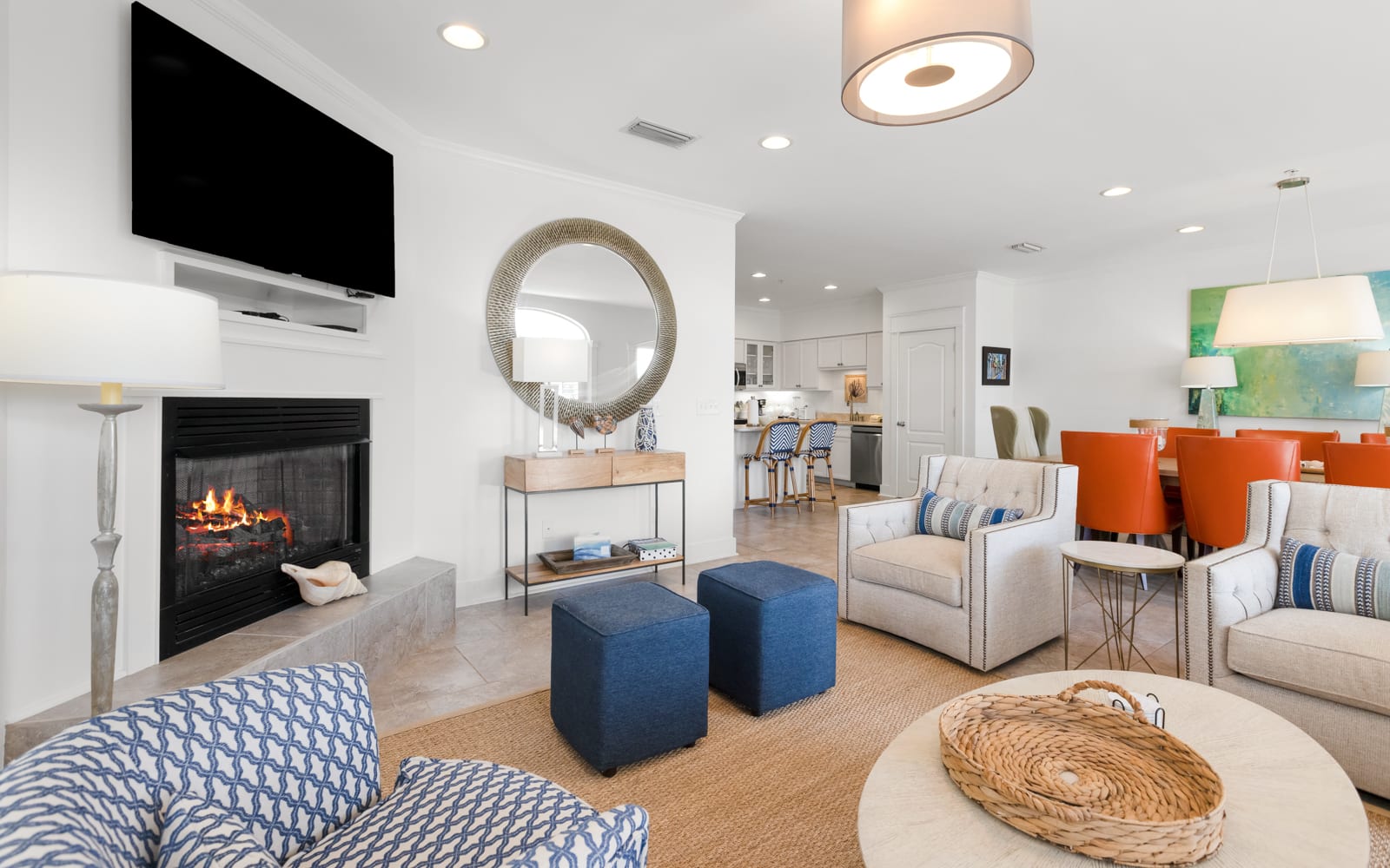 Unwind in your bright, modern living space with cozy fireplace, stylish furnishings, and open kitchen—perfect for relaxing evenings.