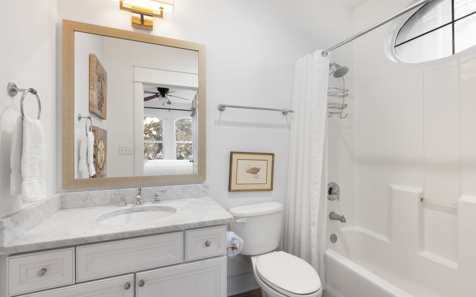 Your pristine bathroom awaits with marble countertops, plush towels, and a relaxing tub-shower combo perfect for unwinding after your adventures.