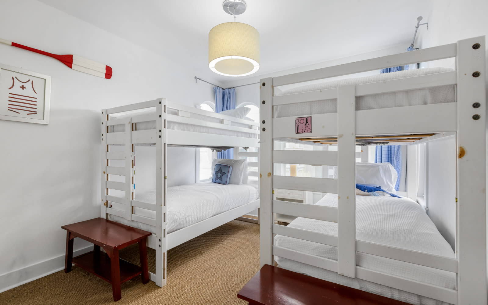 Cozy bunk room with fresh linens and nautical touches - perfect for kids or groups sharing adventures together.