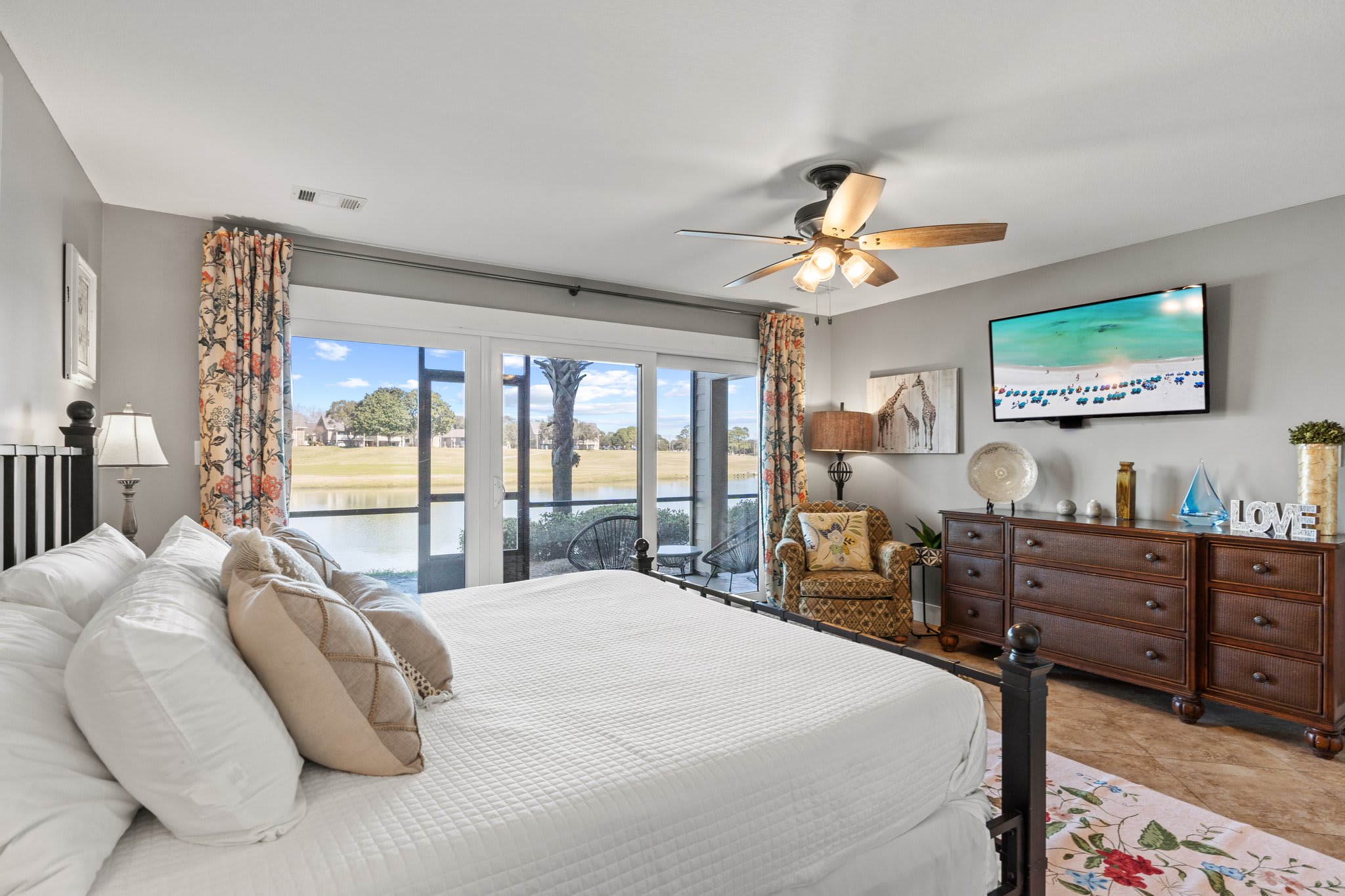 Sliding doors onto private screened porch from primary bedroom