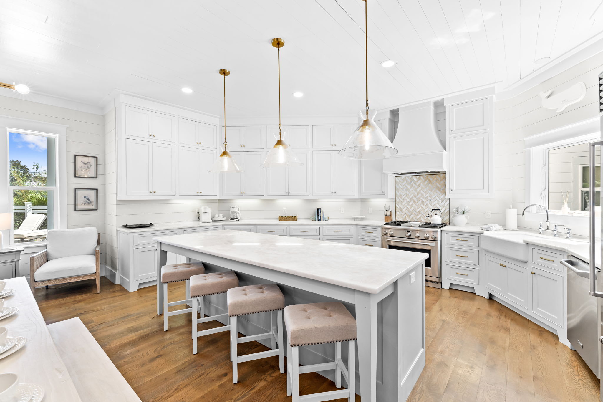 Fully stocked with premium appliances, bar seating, and expansive prep space.