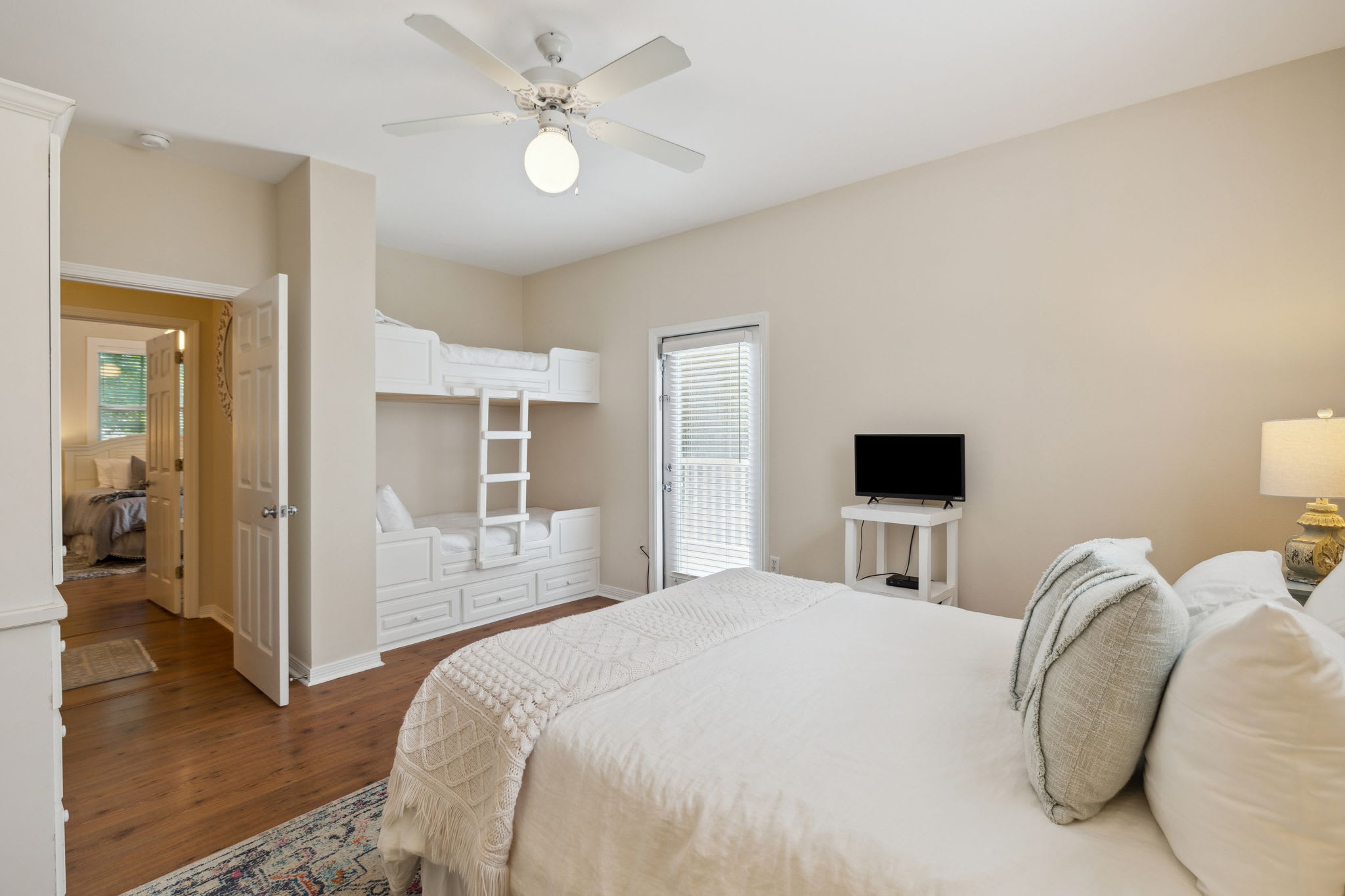 Queen Guest Suite - Equipped with a Twin Bunk & Balcony Access