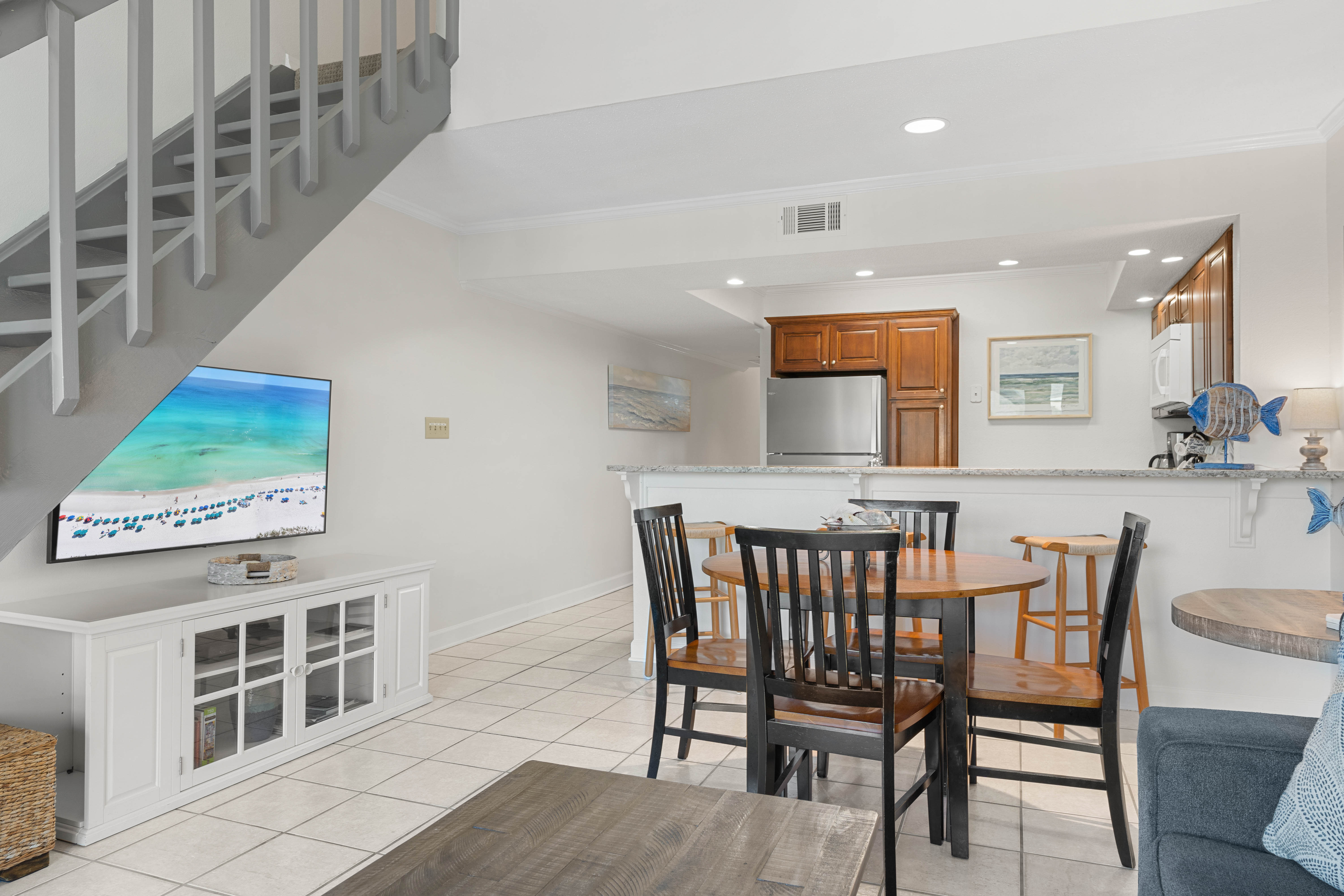 Relax in your bright, open-concept living space with a fully equipped kitchen and cozy dining area perfect for memorable meals.