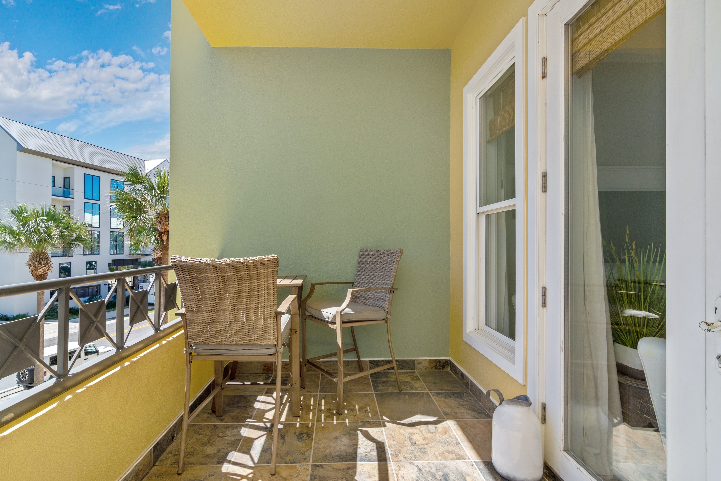 Eating Area on Balcony overlooking 30A with partial Gulf views.