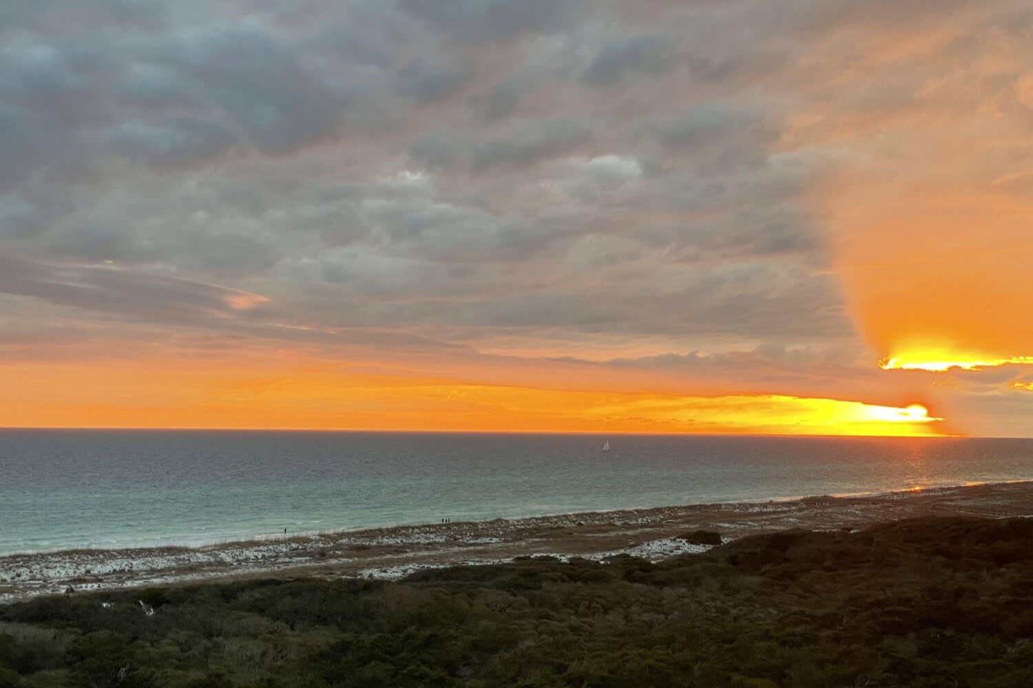 The sun is setting over the Gulf of Mexico.