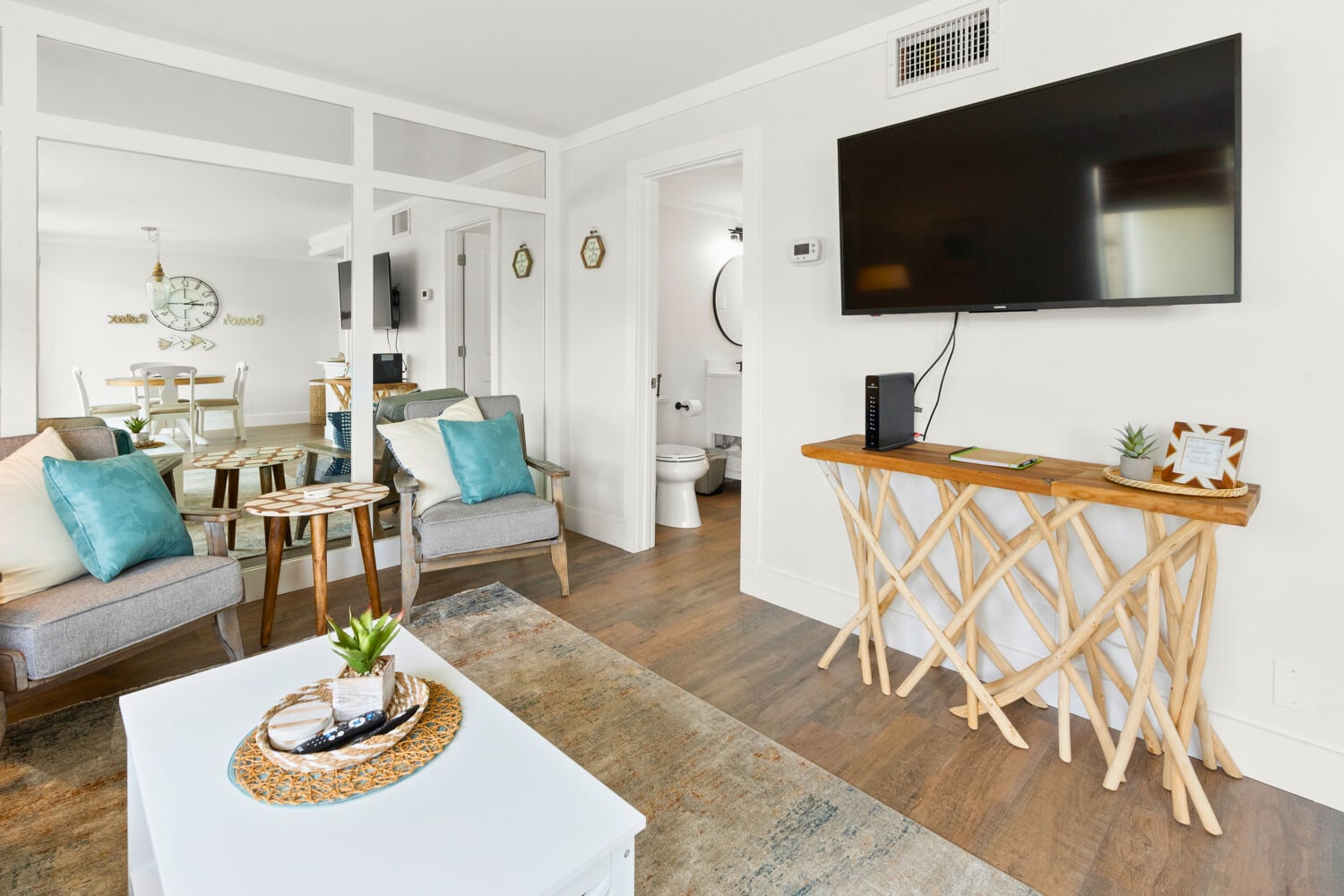 Unwind in your stylish living space with coastal-inspired touches, where cozy seating and modern amenities create the perfect home away from home.