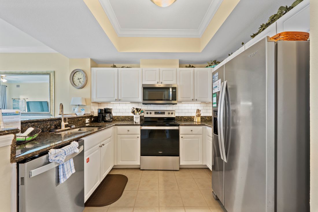 Your fully equipped kitchen awaits with granite countertops, stainless appliances, and everything you need to create memorable meals during your stay.