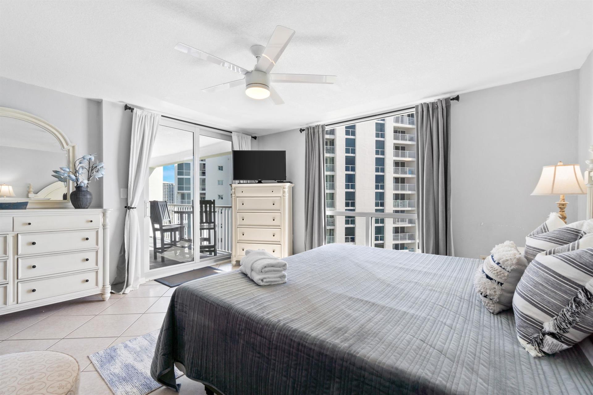 Wake up to stunning city views from your comfortable bedroom with modern amenities and private balcony access.