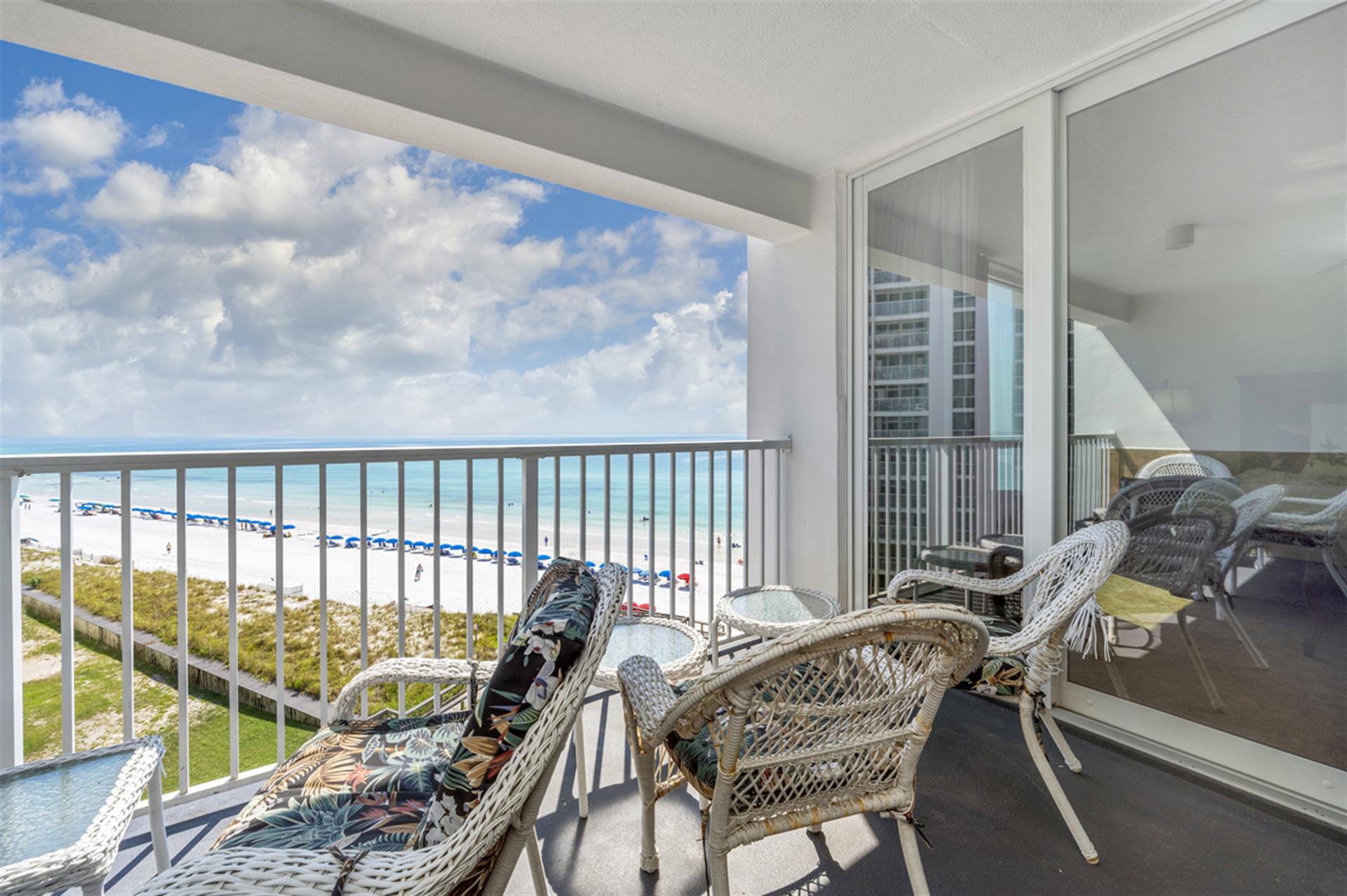 Unwind on your private balcony with stunning ocean views, comfortable wicker seating, and endless blue horizons stretching before you.