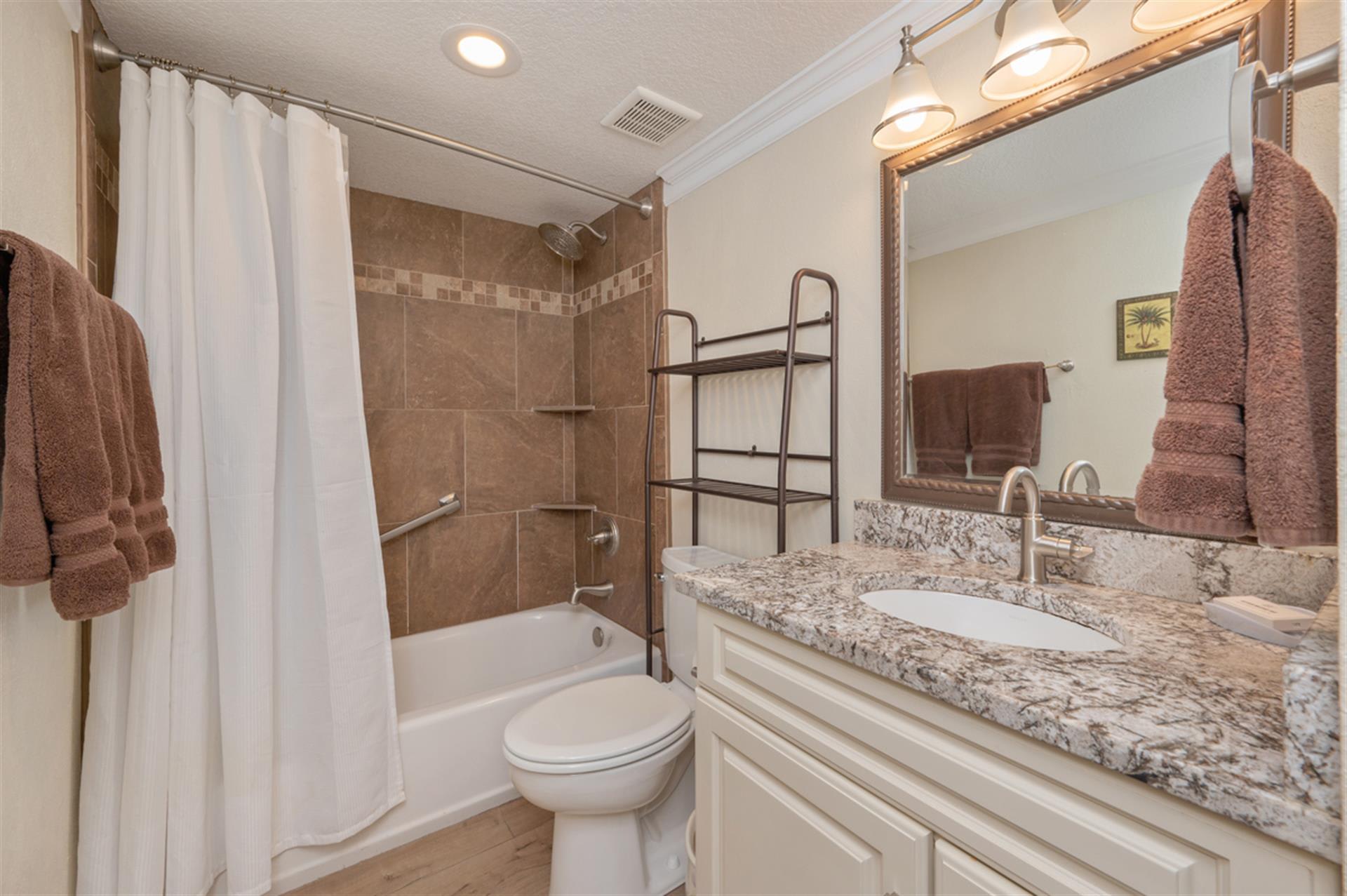 Your bathroom features granite countertops, a tub-shower combo, and plush towels—everything you need to refresh after a day of adventures.