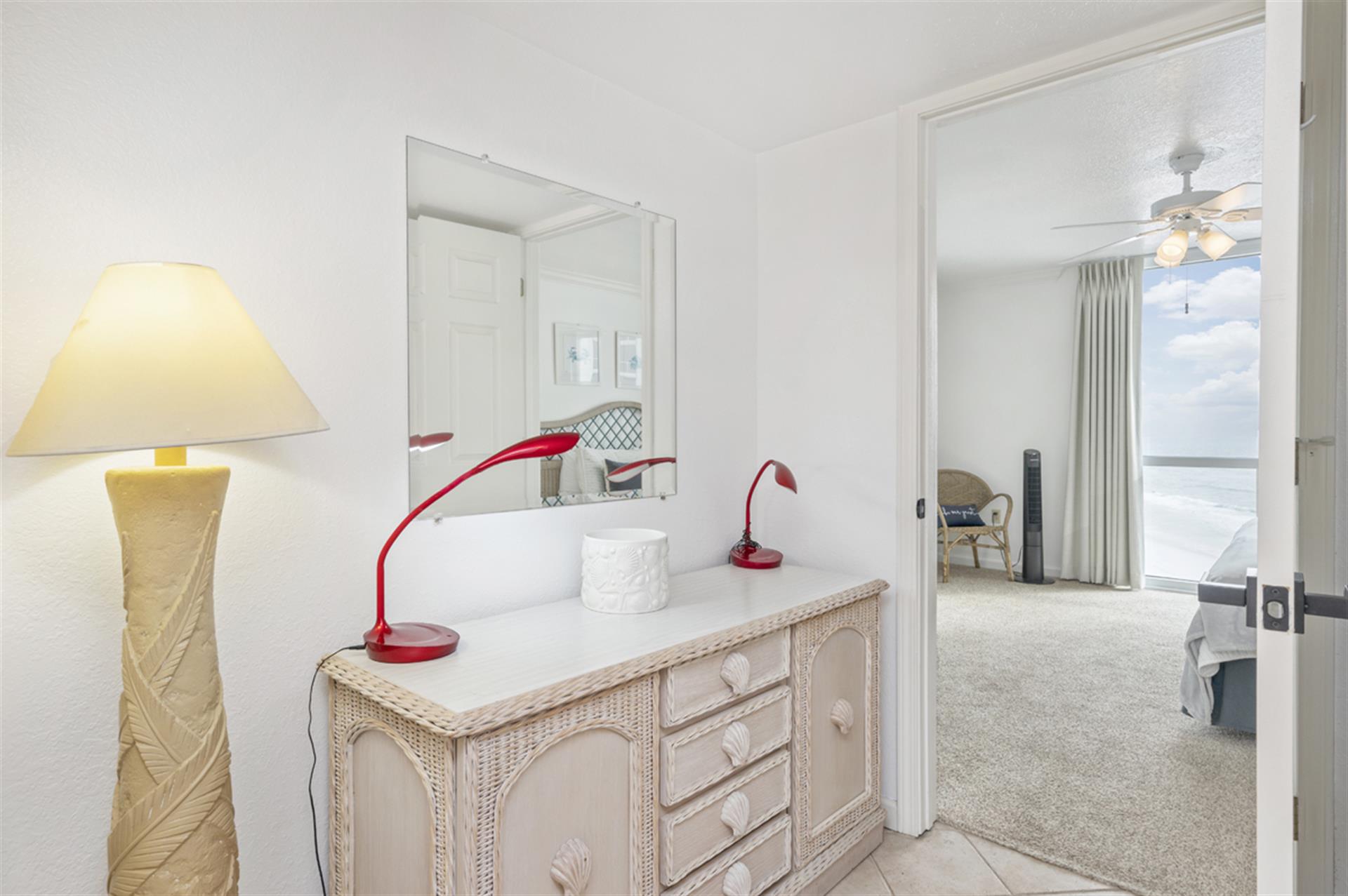 Your bright workspace awaits with coastal charm and ocean views beyond, perfect for staying connected while on vacation.