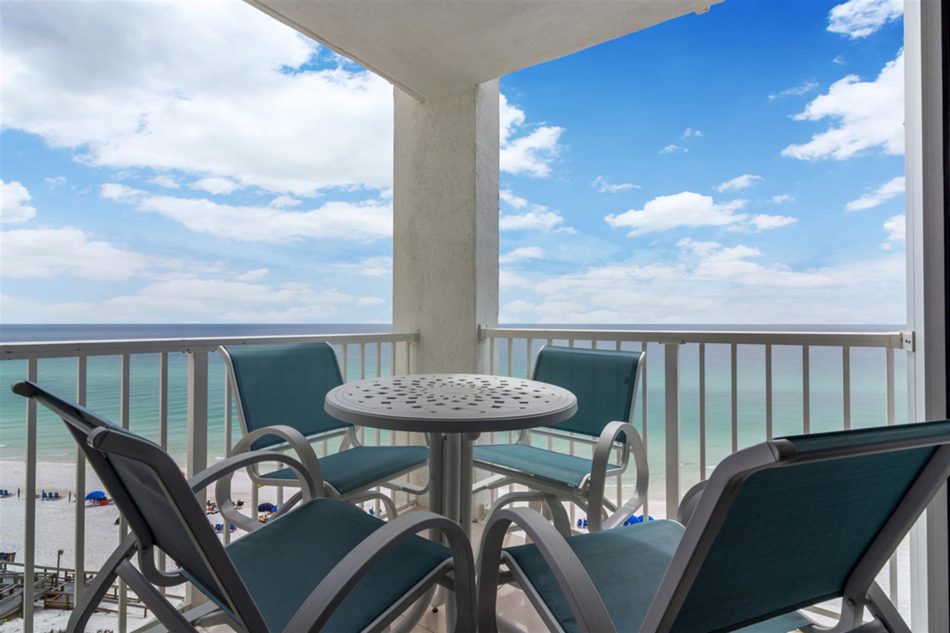 Sip your morning coffee while watching waves crash below from this oceanfront balcony with comfortable seating.