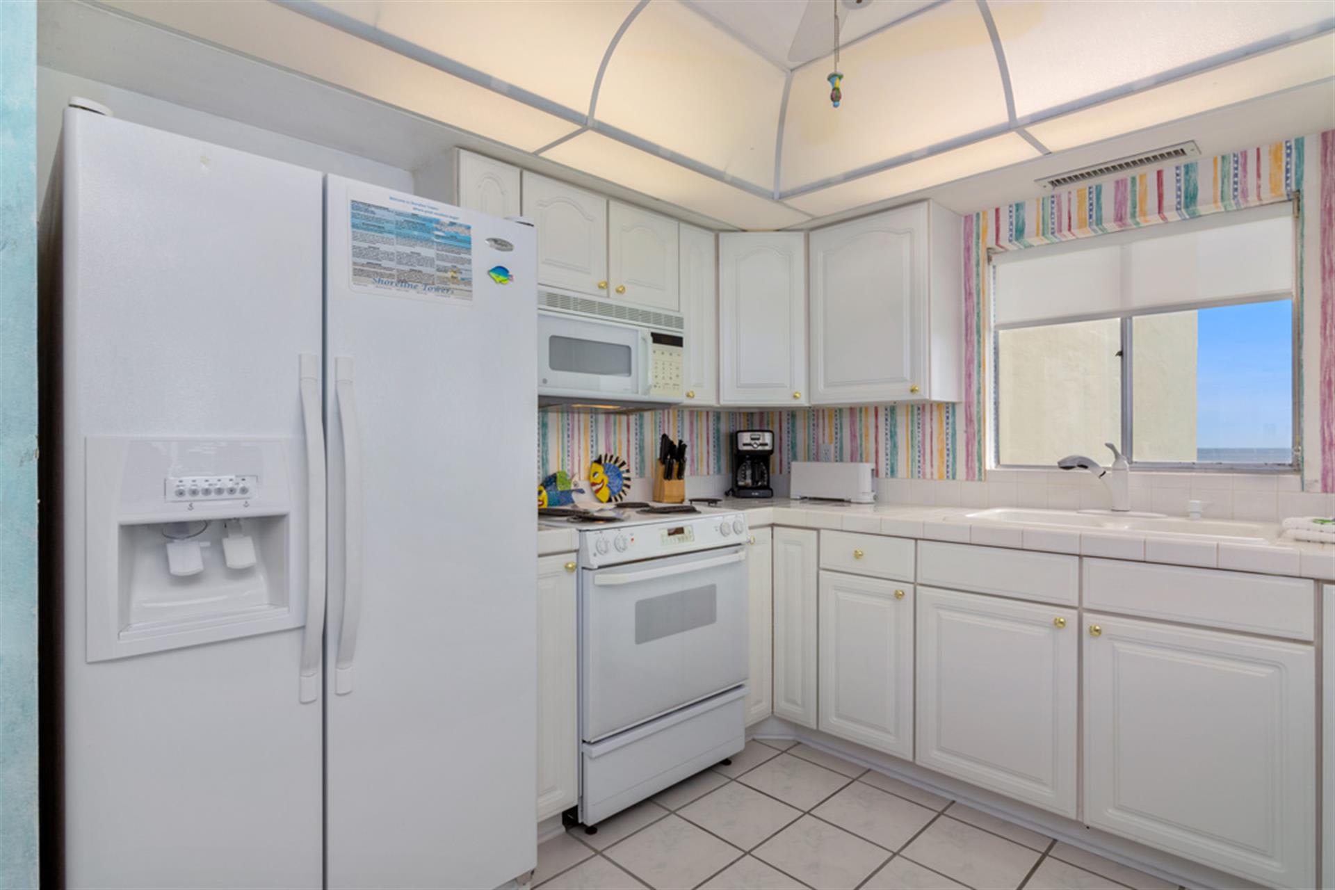 Your fully-equipped kitchen invites culinary adventures with modern appliances and cheerful accents—perfect for preparing meals together.