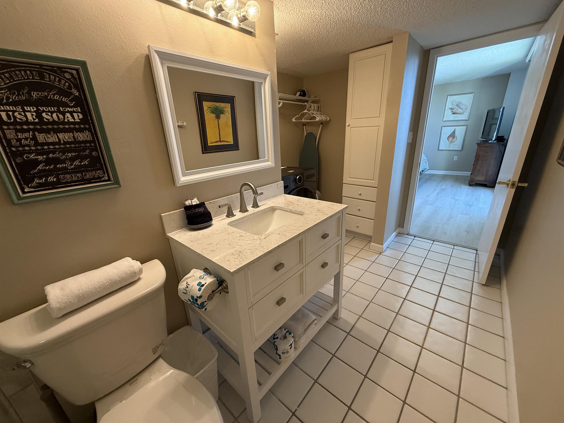 Your spacious bathroom features marble countertops, thoughtful storage, and fresh towels waiting for your arrival.
