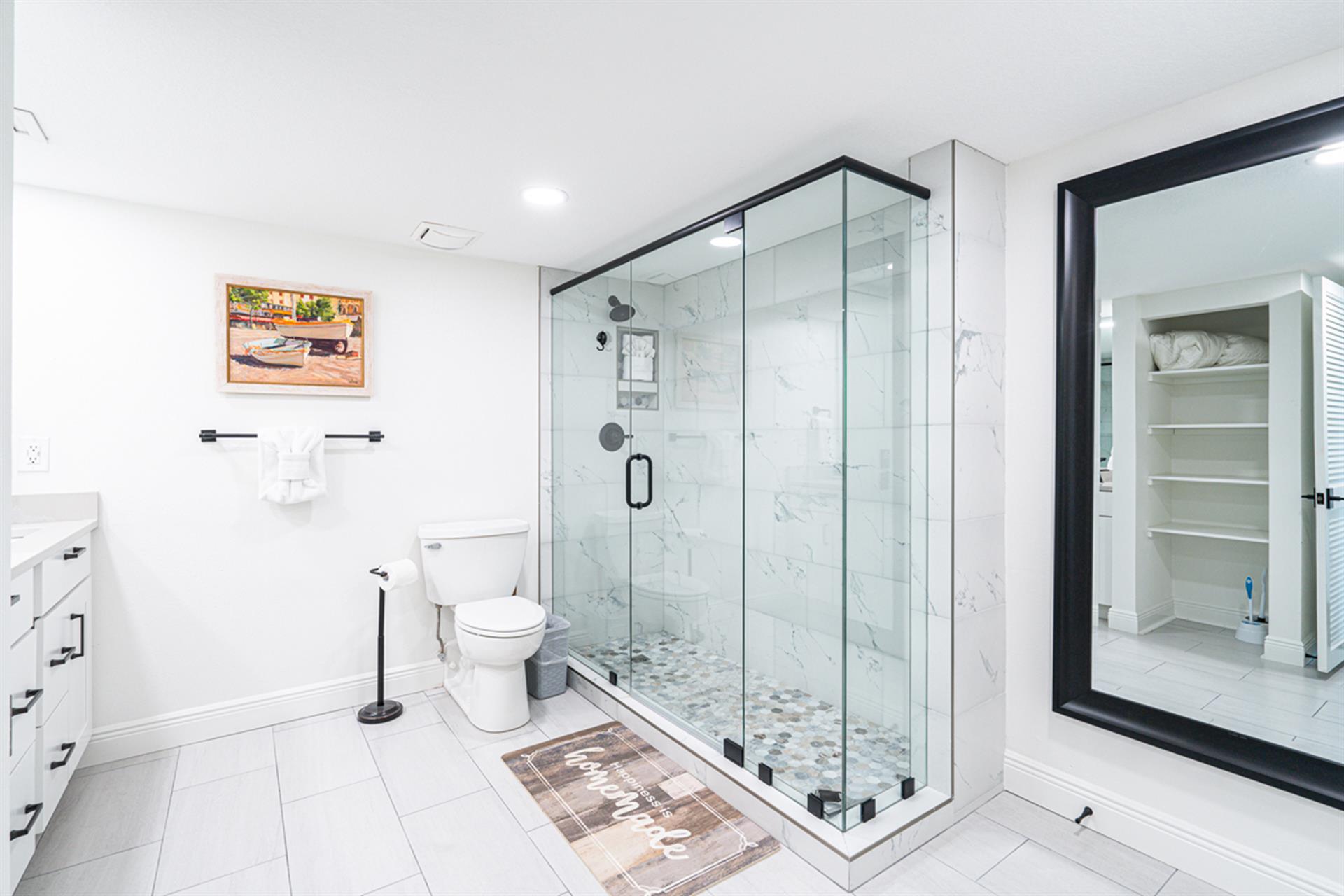 Indulge in your private spa-like retreat with luxurious marble shower, elegant vanity, and thoughtful storage—your perfect sanctuary.