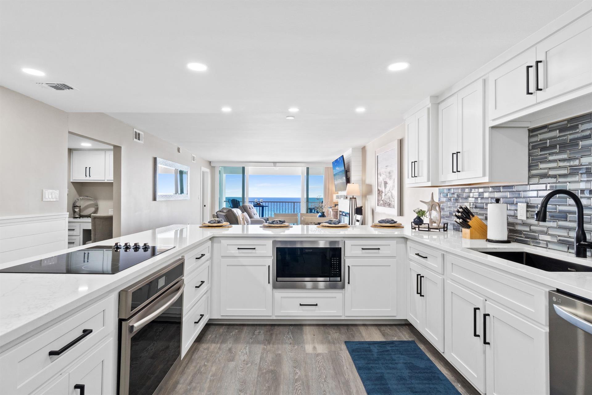 Cook with panoramic ocean views in your fully-equipped modern kitchen, complete with granite counters and stainless appliances.