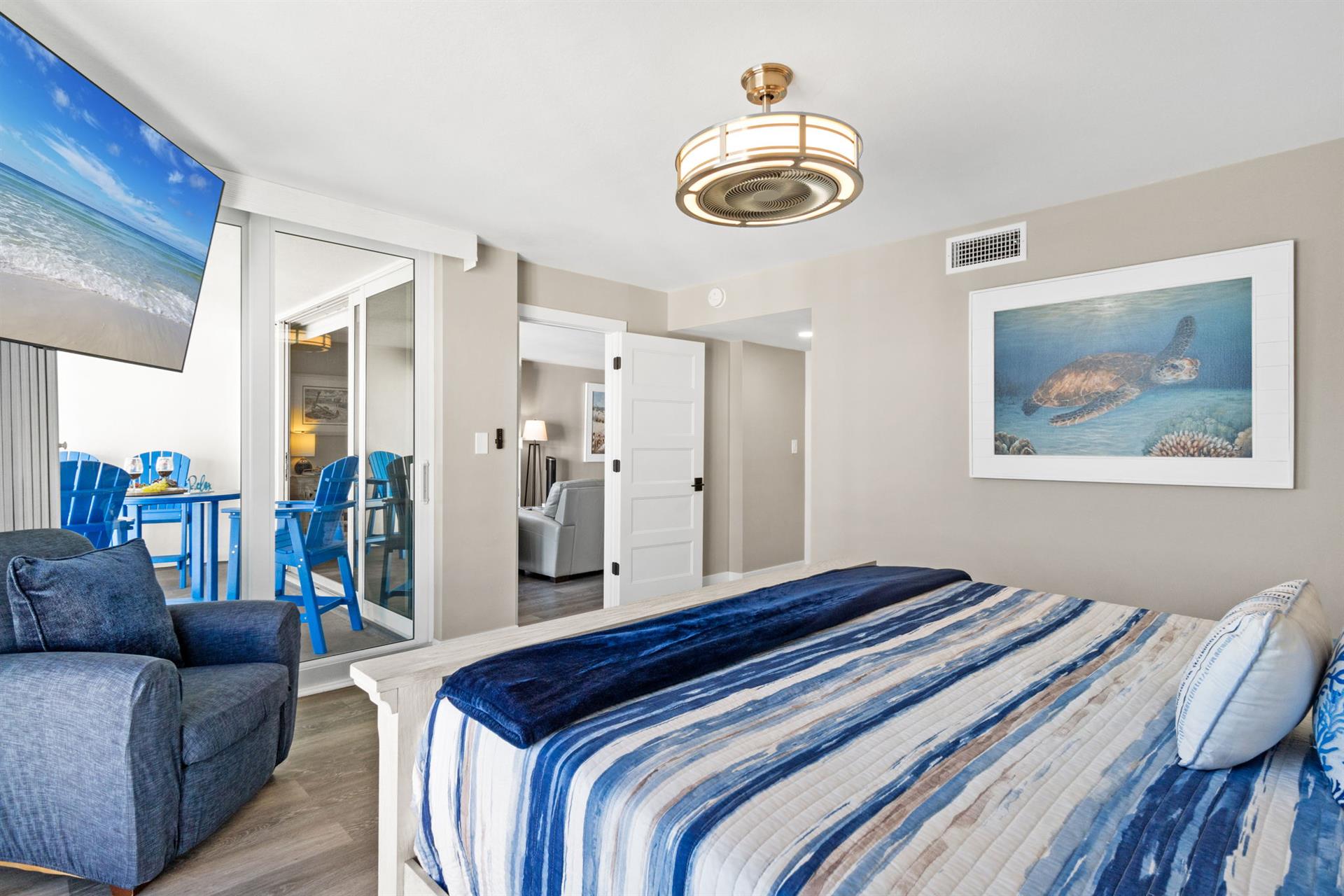 Drift into ocean dreams in your coastal bedroom with comfortable seating and serene sea turtle artwork creating the perfect beach getaway.