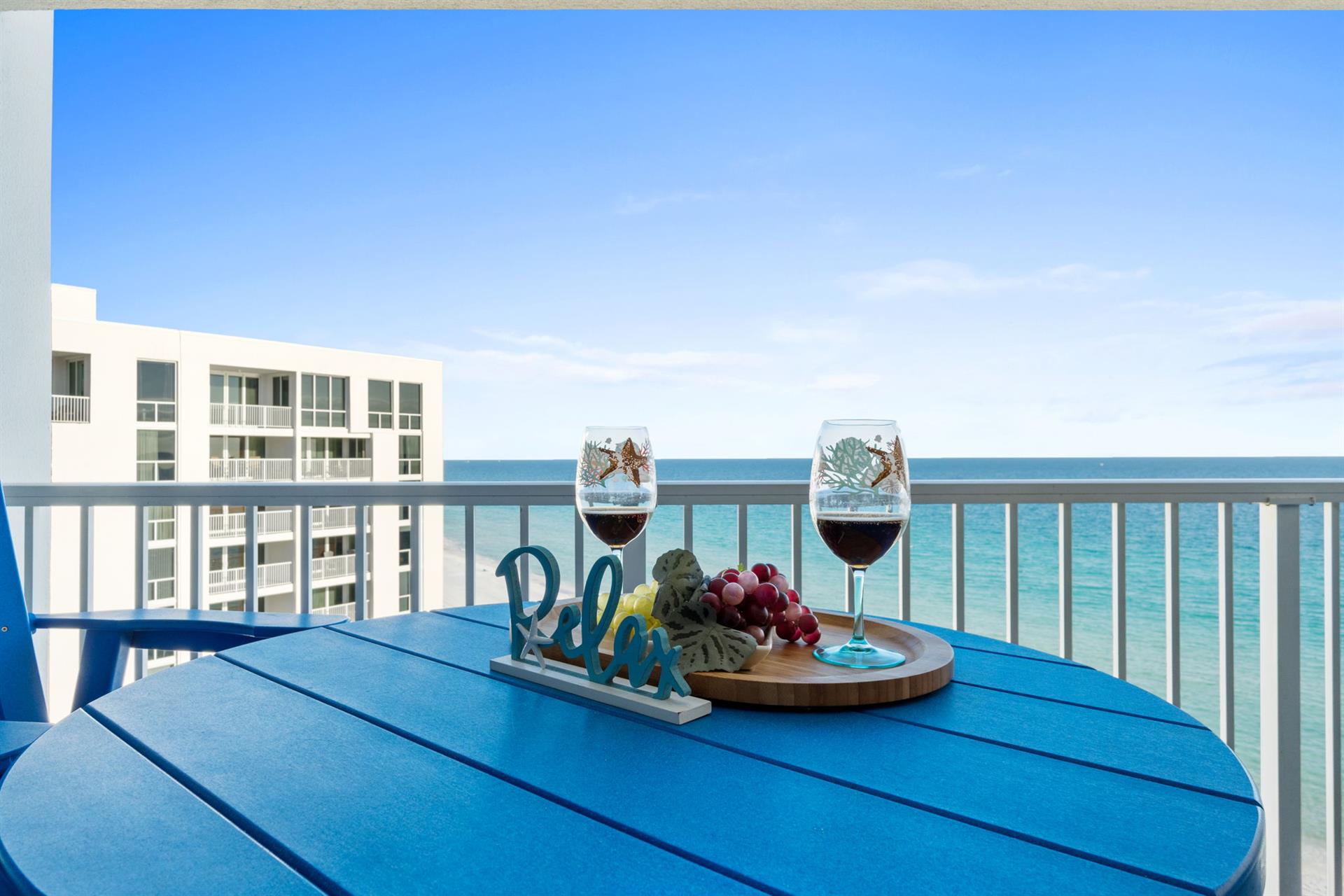 Savor wine and fresh fruit on your private balcony while watching waves dance beneath endless blue skies.