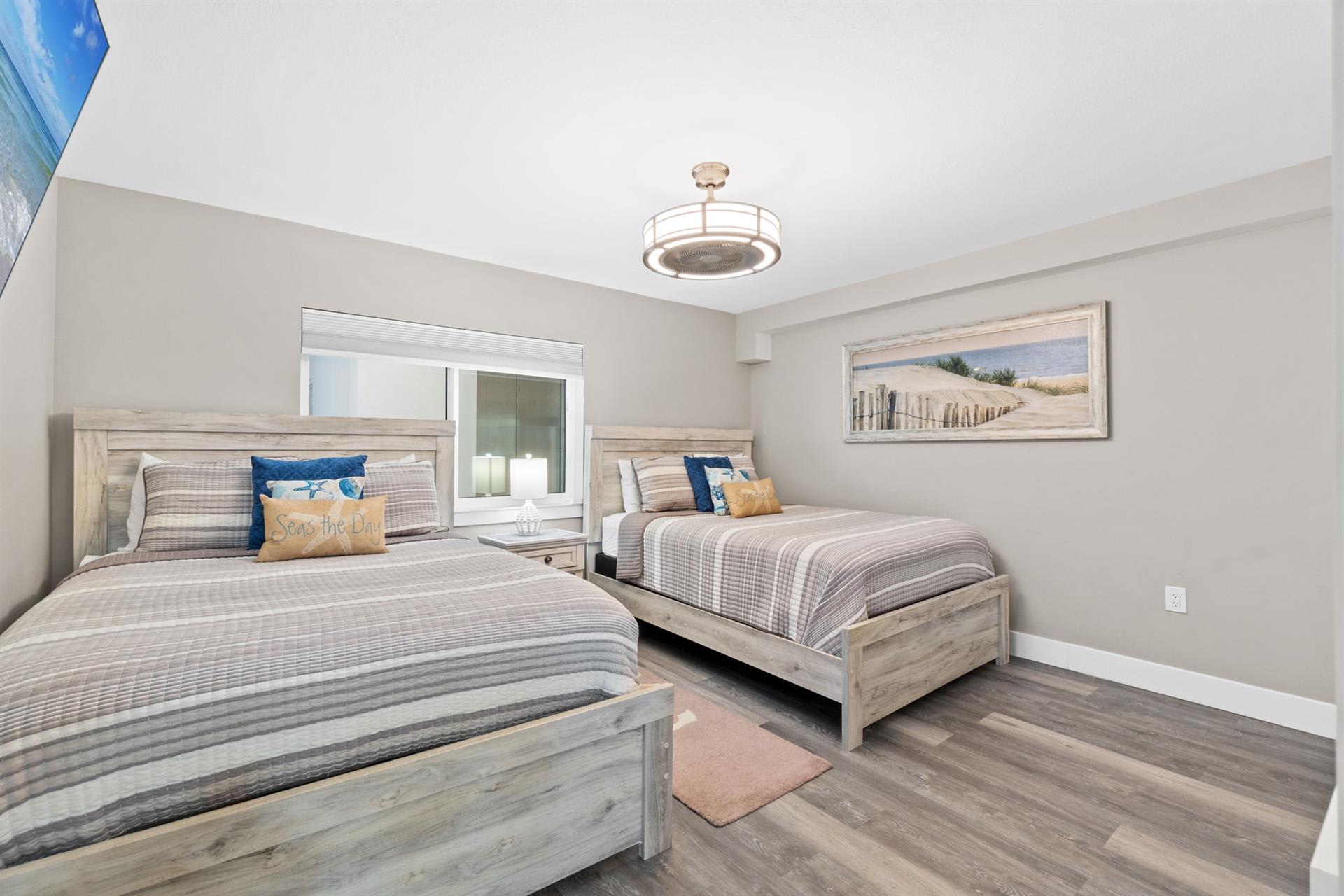 Drift off in this peaceful twin bedroom with coastal-inspired decor and premium linens for your perfect night's rest.