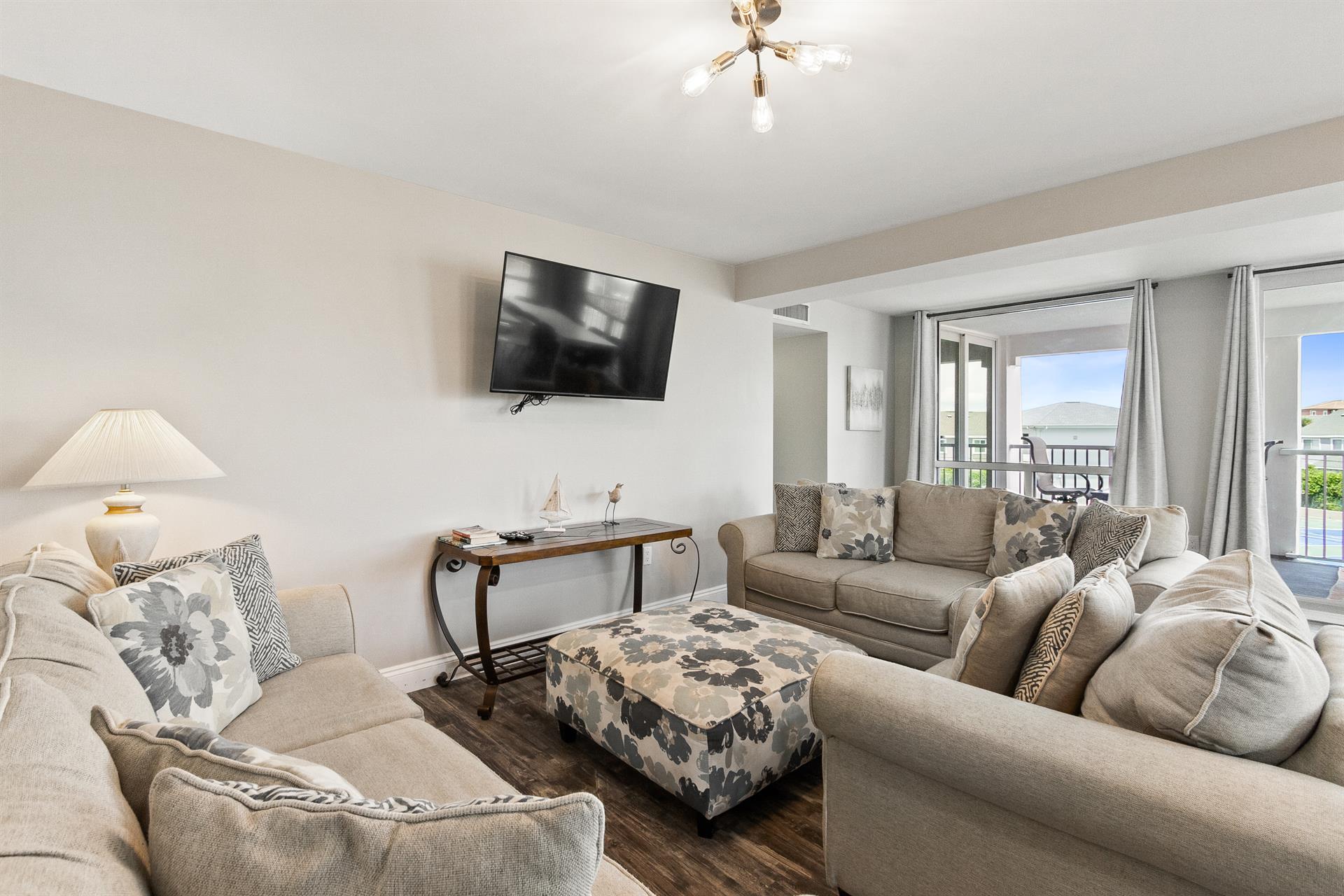 Sink into plush sofas and unwind in your spacious living room, where natural light streams through large windows.