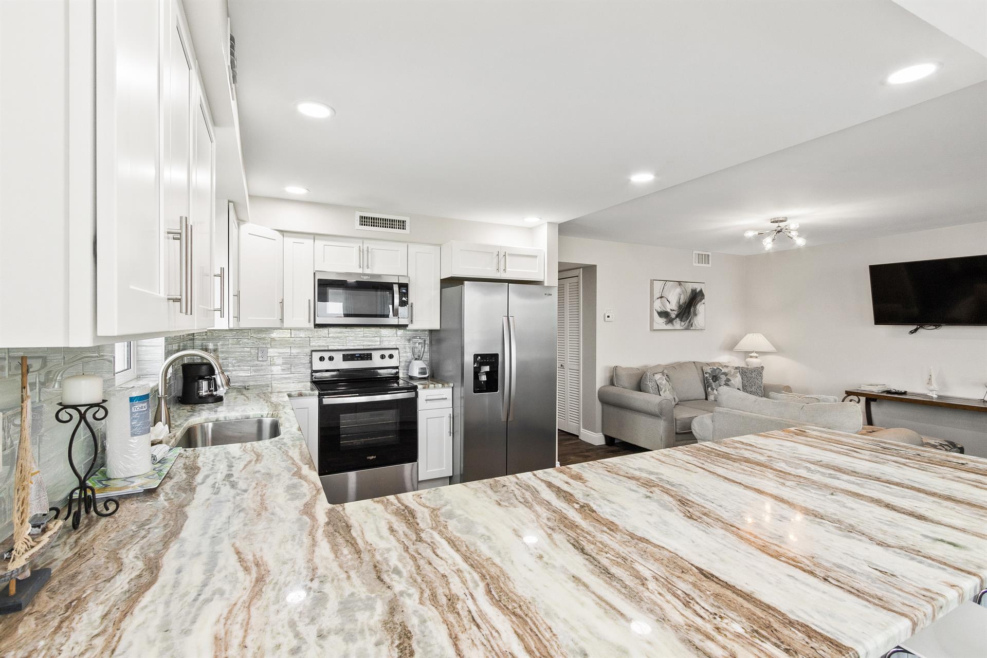 Your gorgeous marble kitchen flows seamlessly into the cozy living area, perfect for cooking and relaxing together.