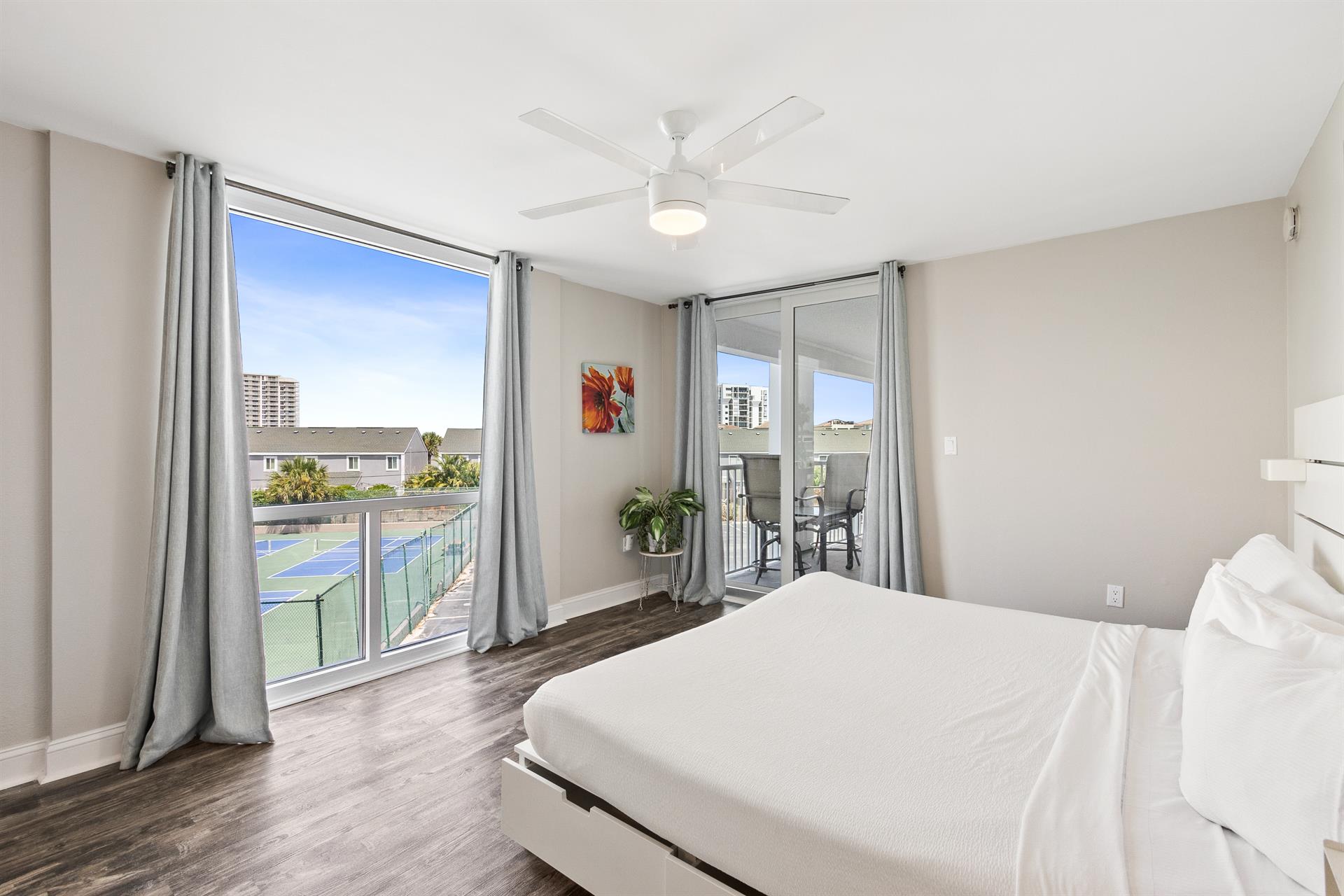 Wake up in your bright bedroom with stunning views and your own private balcony. The cooling ceiling fan keeps you comfortable.