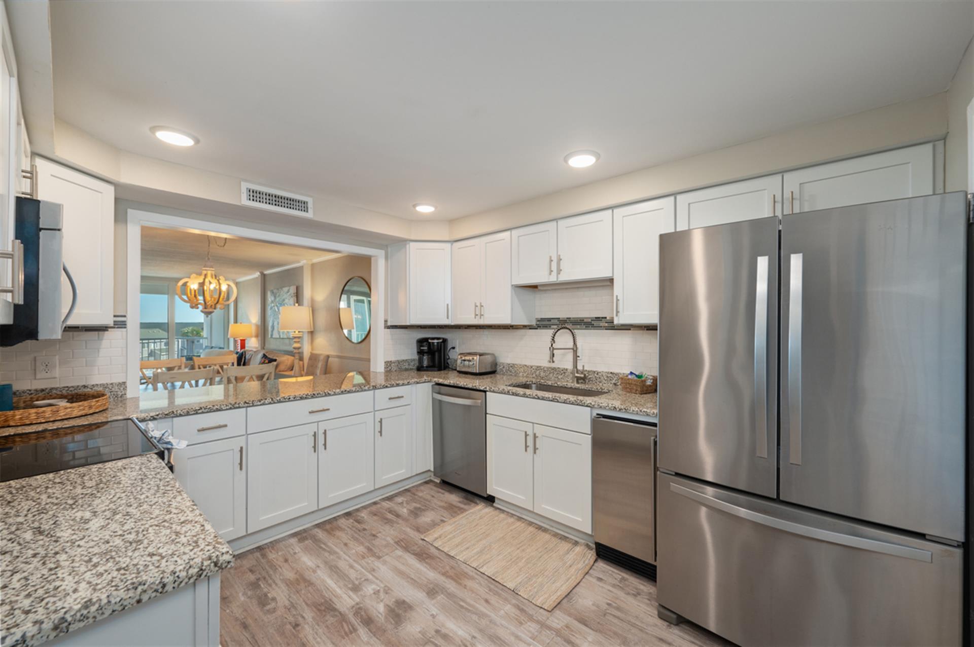 Your fully-equipped kitchen awaits with granite countertops, stainless steel appliances, and everything needed to create memorable meals during your stay.