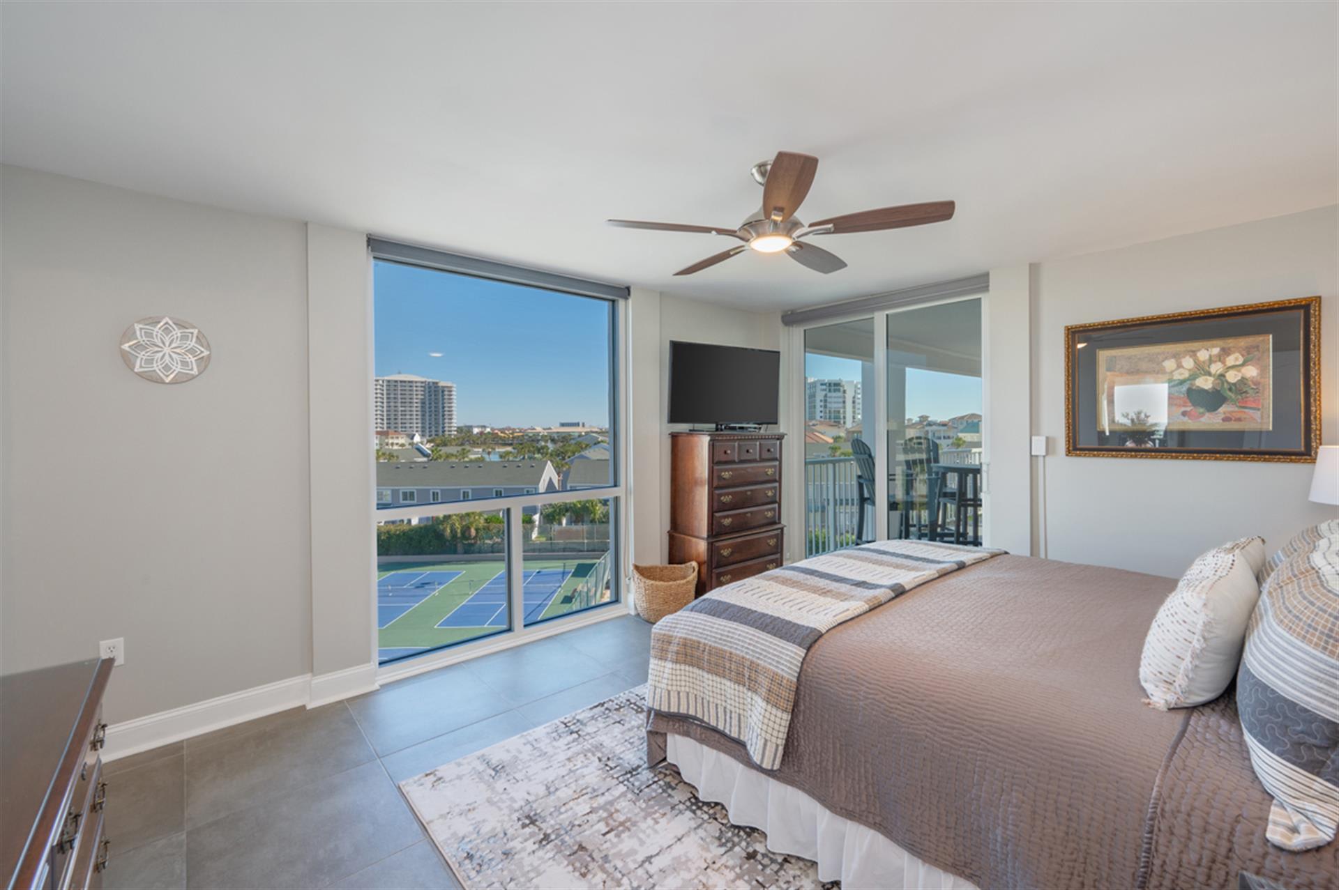 Wake up to stunning city views from your bright, modern bedroom with floor-to-ceiling windows that flood the space with natural light.