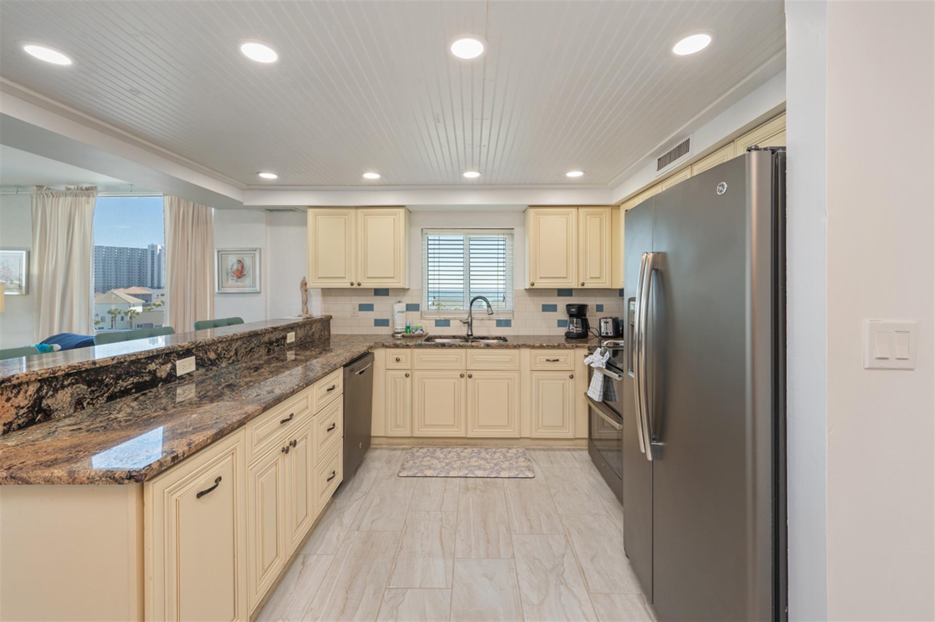 Your fully-equipped kitchen features granite countertops, stainless appliances, and city views to inspire your culinary adventures.