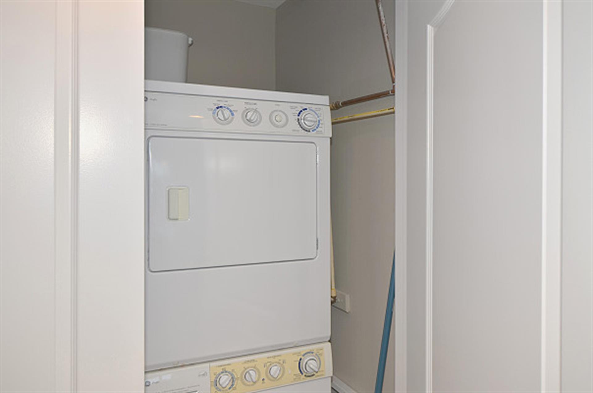 Your private laundry closet features a stacked washer and dryer for ultimate convenience during your stay.