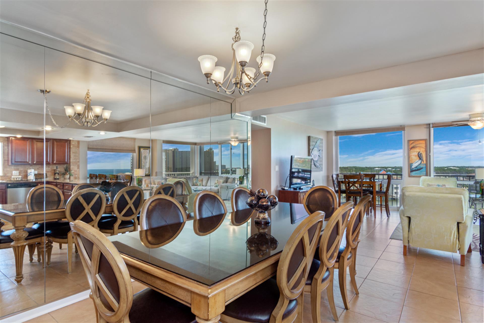 Enjoy elegant dining with sweeping city views from your sophisticated space, where crystal chandeliers create perfect ambiance for memorable meals.