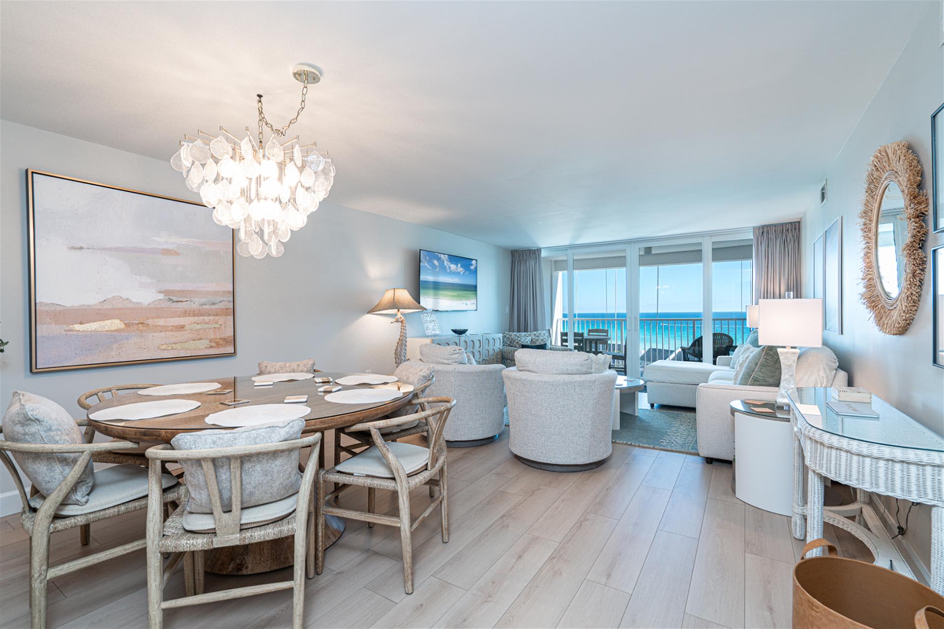 Relax in this stunning oceanfront living space where elegant coastal decor meets breathtaking sea views from your private balcony.