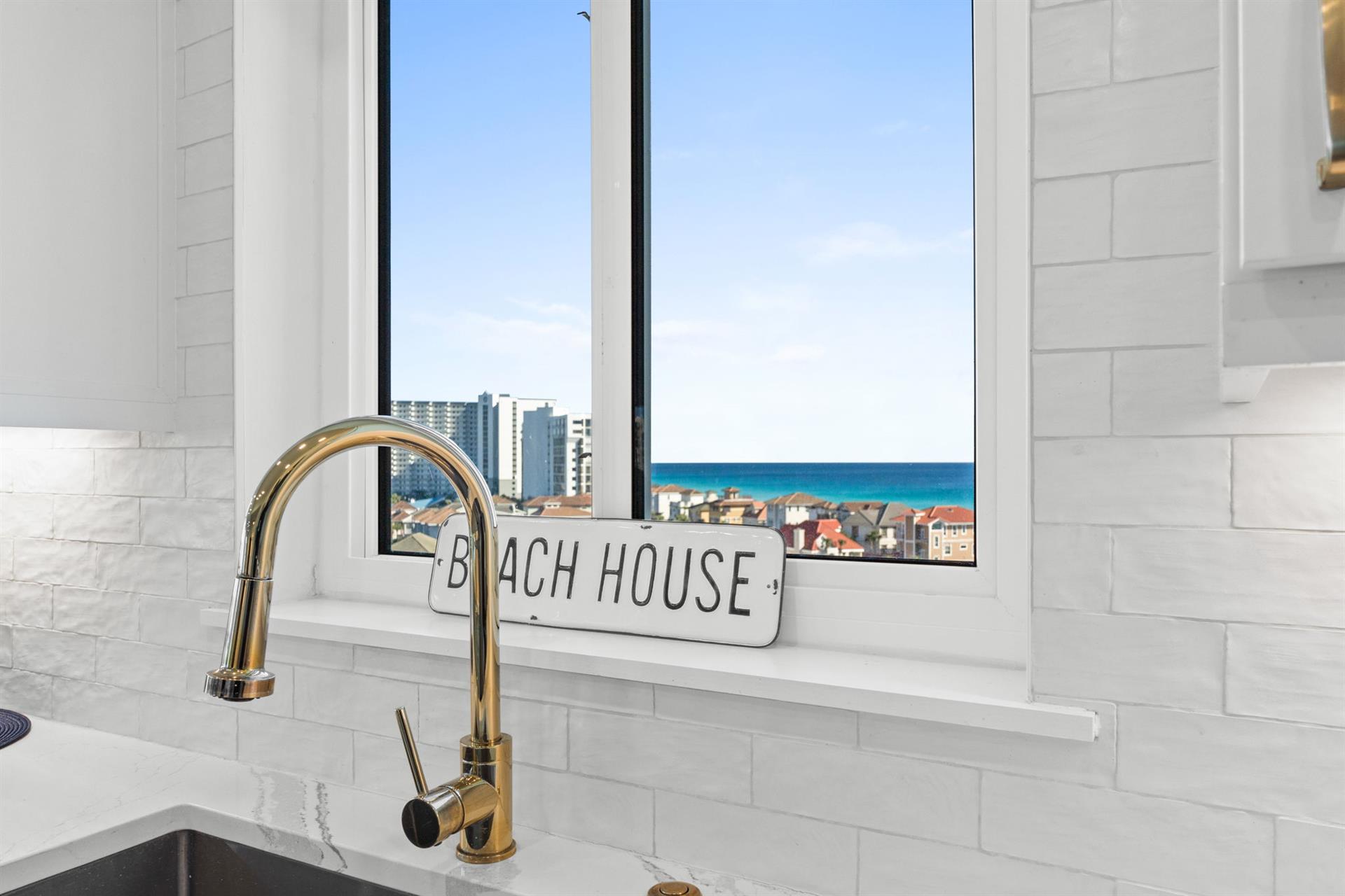 Cook with ocean views through your kitchen window, where turquoise waters and sandy shores create the perfect backdrop for morning coffee.