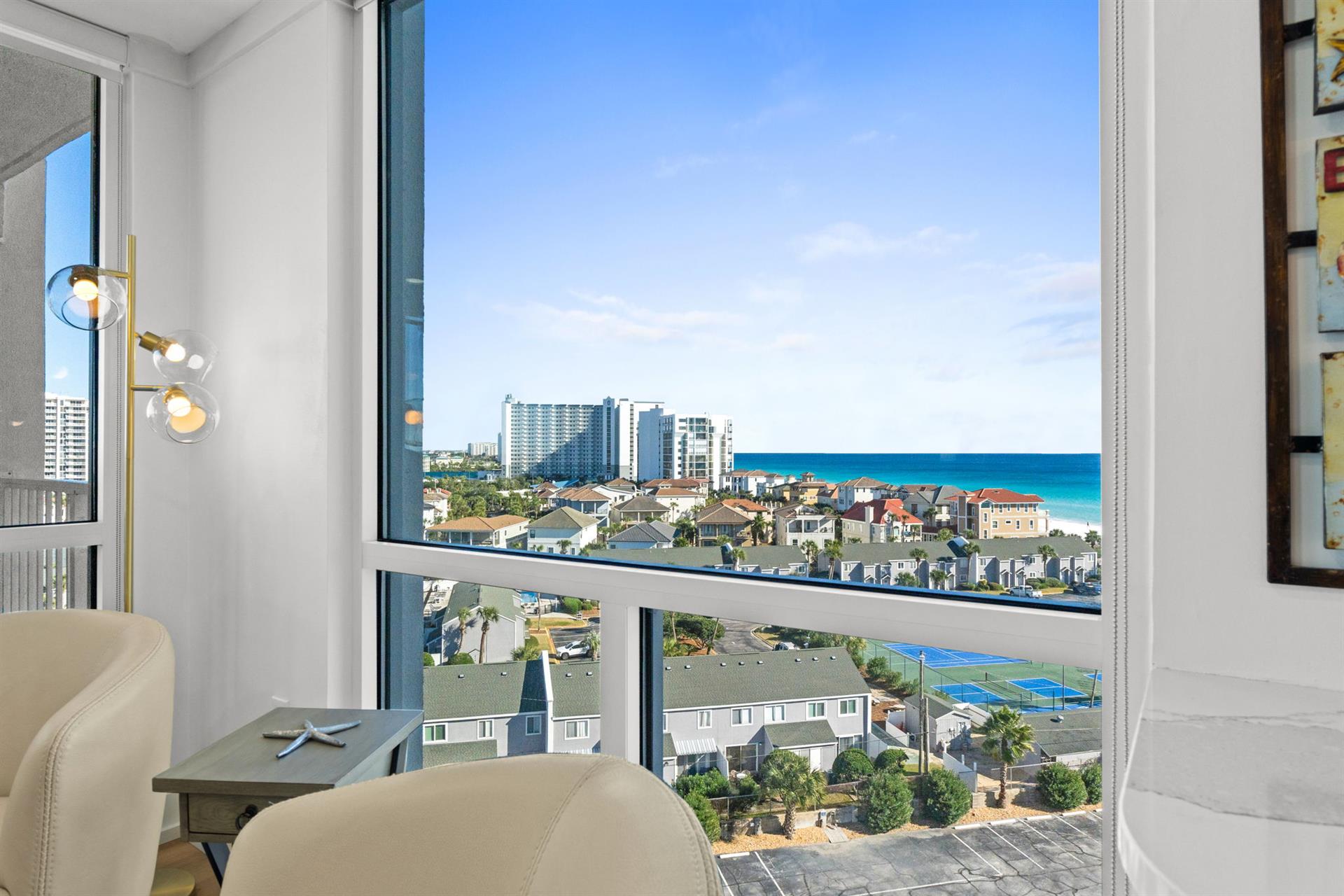 Breathtaking ocean views and cityscape stretch before you from floor-to-ceiling windows in your bright, modern living space.
