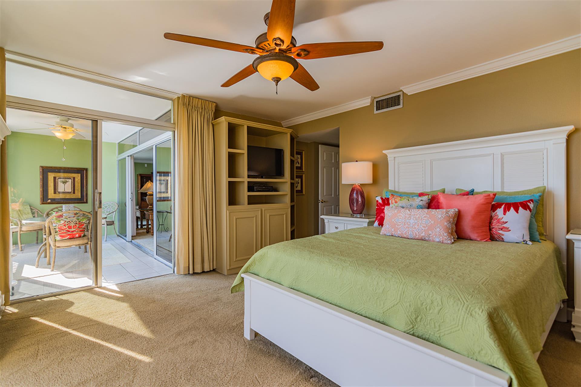 Wake up refreshed in your comfortable bedroom with cheerful tropical colors and sliding doors to your private balcony.
