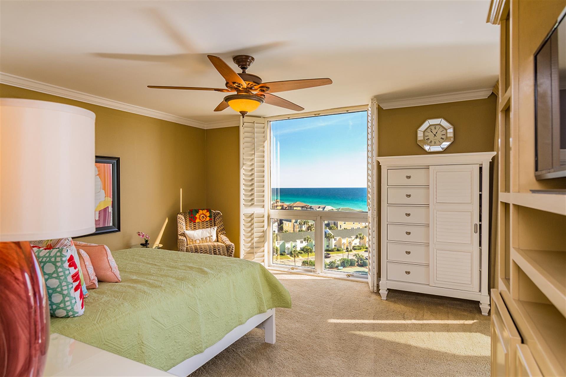 Wake up to stunning ocean views from your comfortable bedroom with tropical breezes from the ceiling fan.