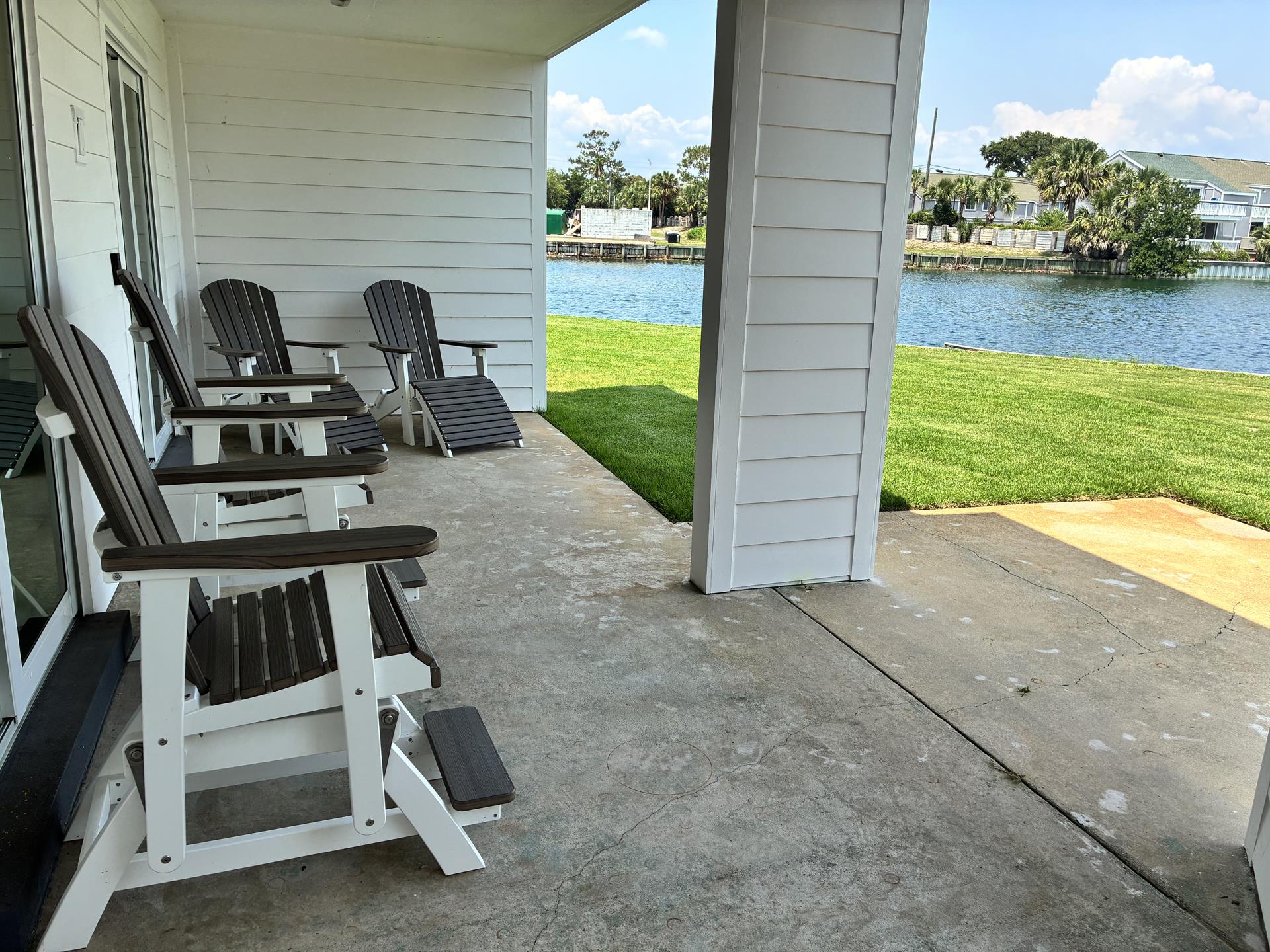 Relax in your waterfront chairs while watching boats drift by on the sparkling canal just steps from your door.