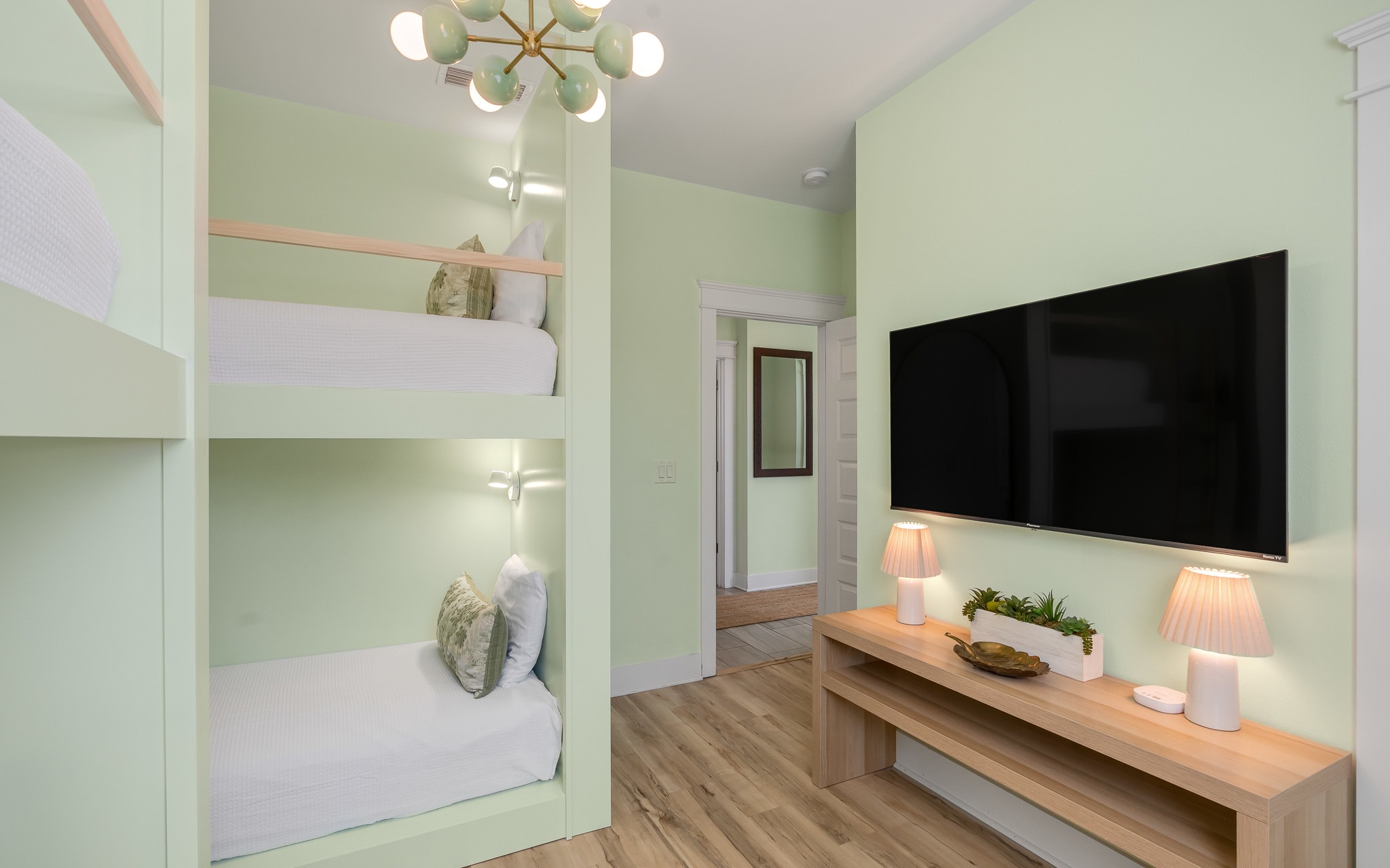 Relax in your custom bunk room with built-in beds, cozy reading lights, and entertainment center for family fun.