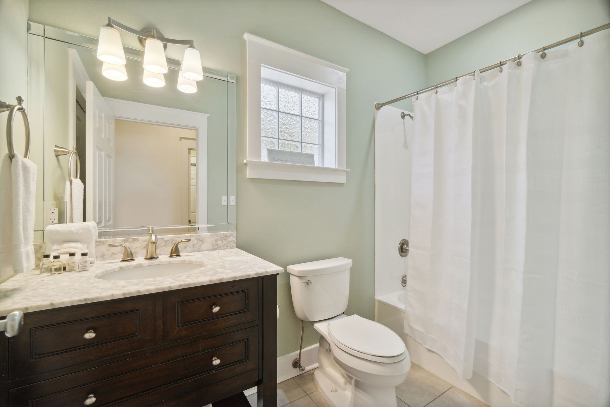 1st Floor Guest Bathroom - Equipped with a Tub/Shower Combination