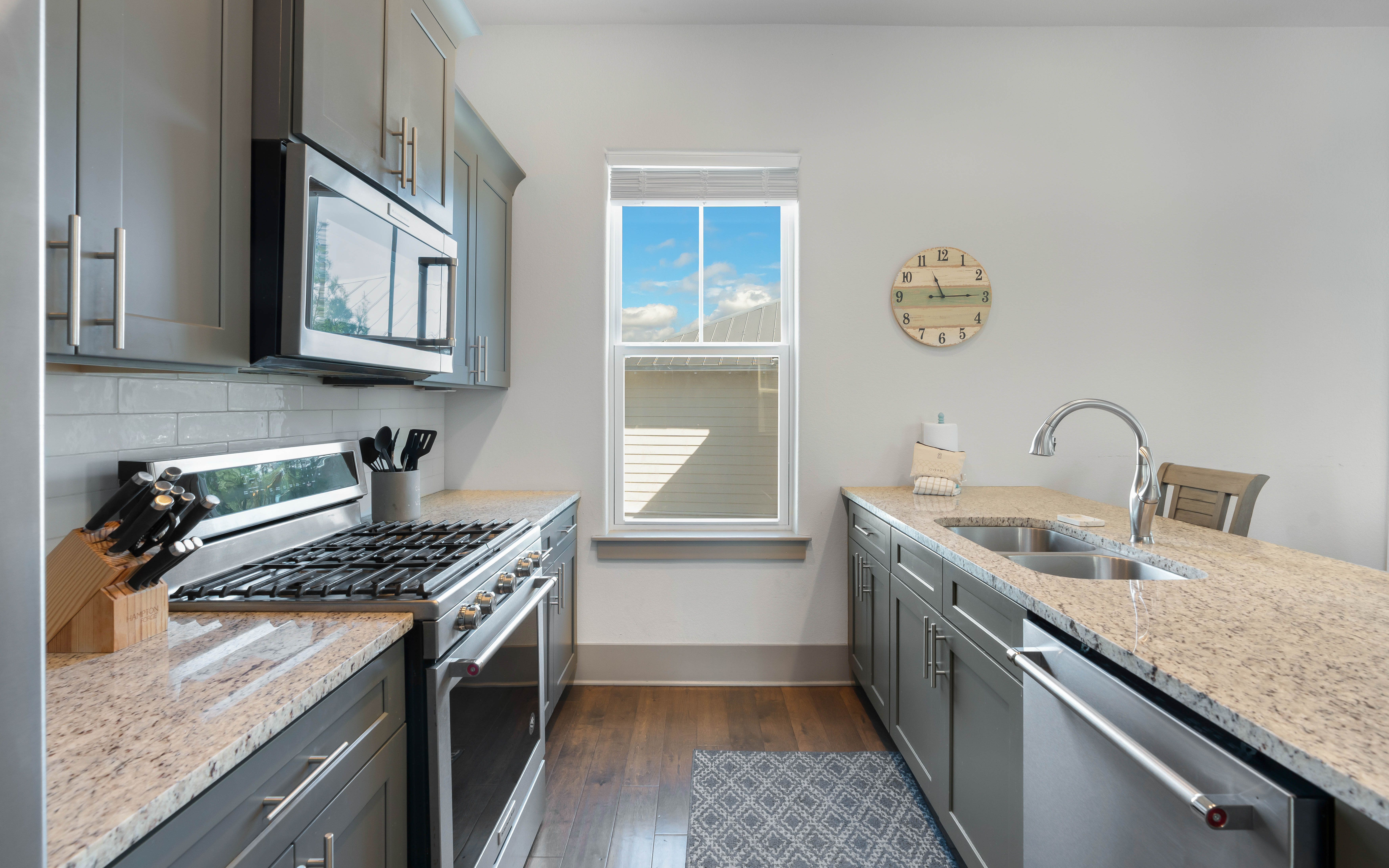 Cook your favorite meals in this fully equipped kitchen with granite counters, gas range, and dishwasher—everything you need for a perfect stay.