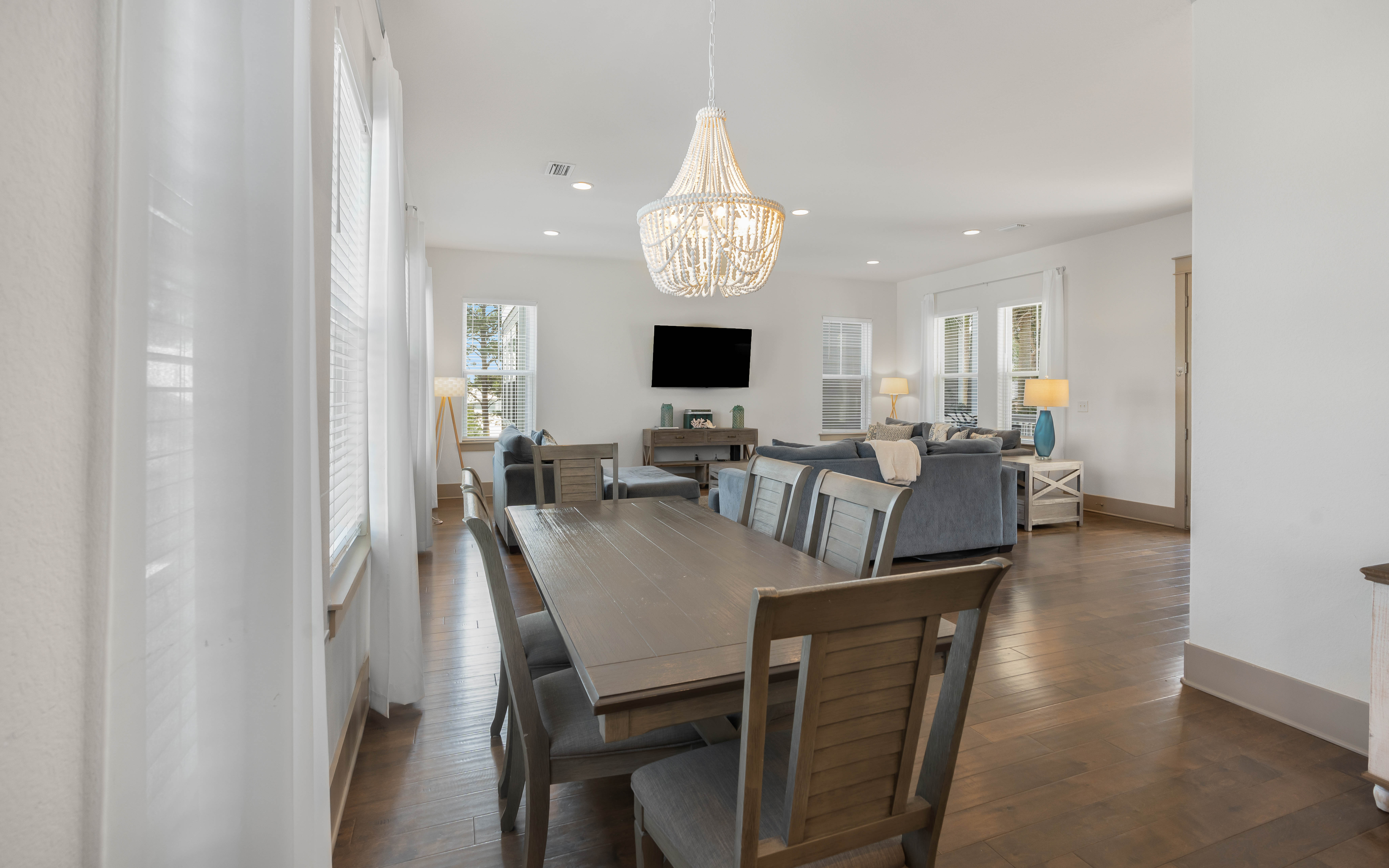Gather around your spacious dining table beneath the stunning beaded chandelier, then unwind in the comfortable living area with flatscreen entertainment.