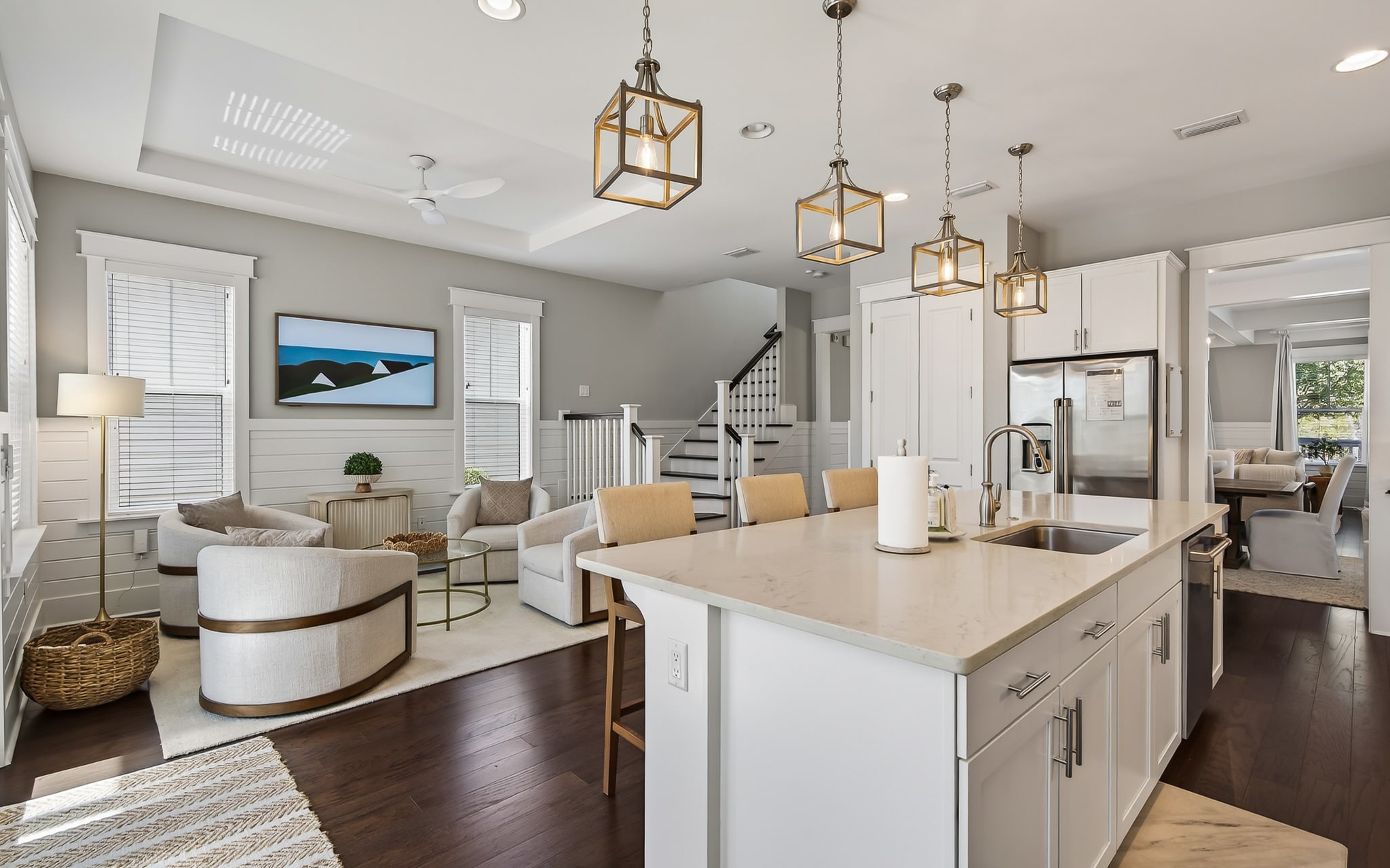 Step into your stylish open-concept space where the modern kitchen flows seamlessly into your living area, perfect for gathering and cooking.