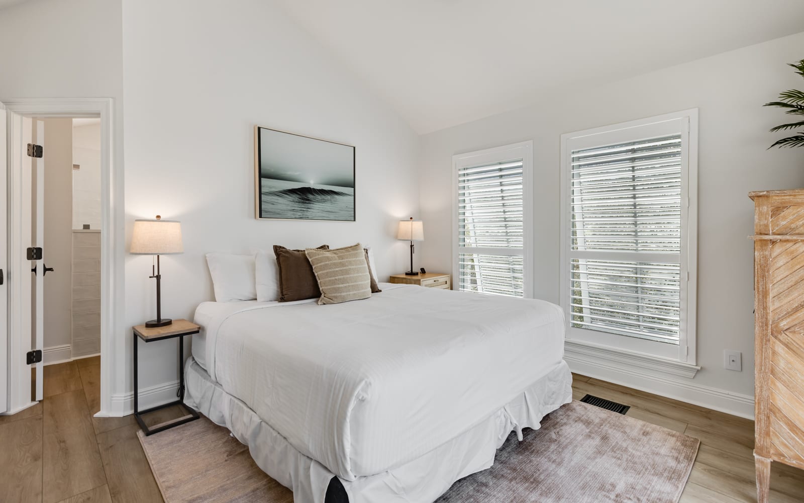 Drift into peaceful sleep in your serene bedroom, where soft linens and coastal artwork create the perfect retreat after your adventures.