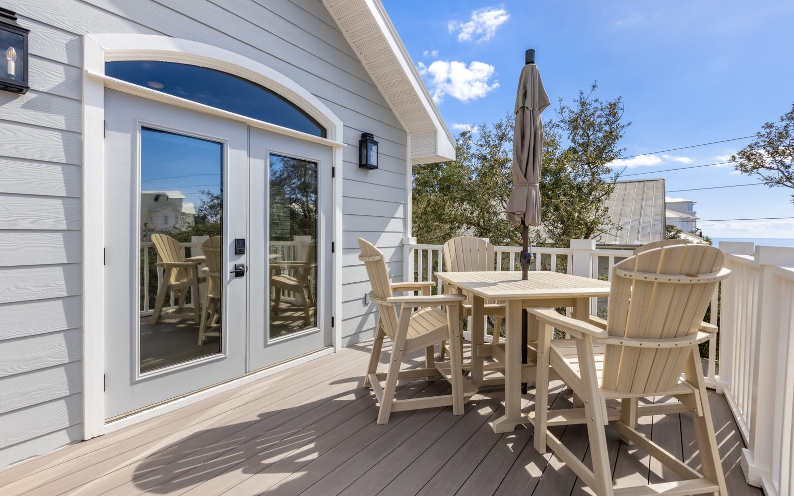 Step onto your private deck where morning coffee tastes better in coastal air, with comfortable seating perfect for sunset dinners and stargazing.