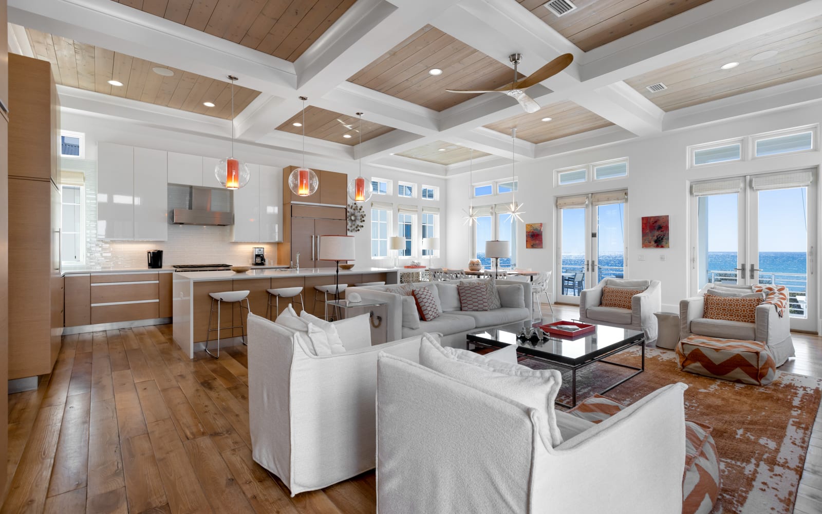 Relax in this stunning open-concept space where modern luxury meets coastal charm, with ocean views streaming through floor-to-ceiling windows.