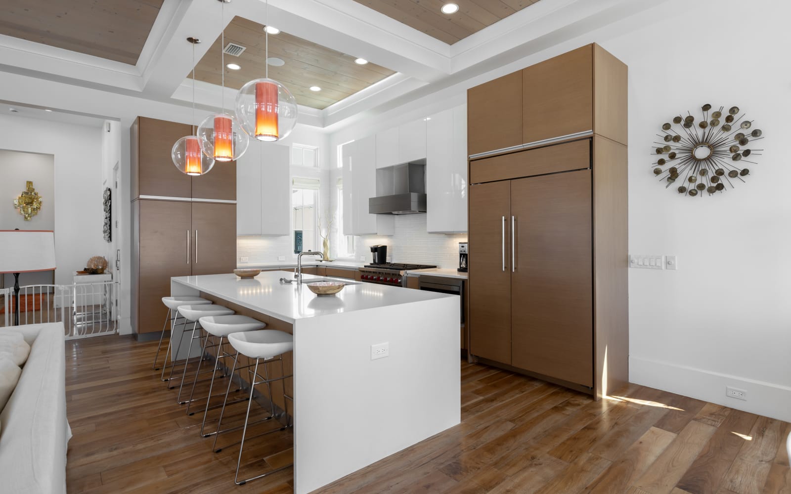 Your stylish kitchen features sleek wood cabinetry, pristine white countertops, and modern pendant lighting for memorable meal prep.