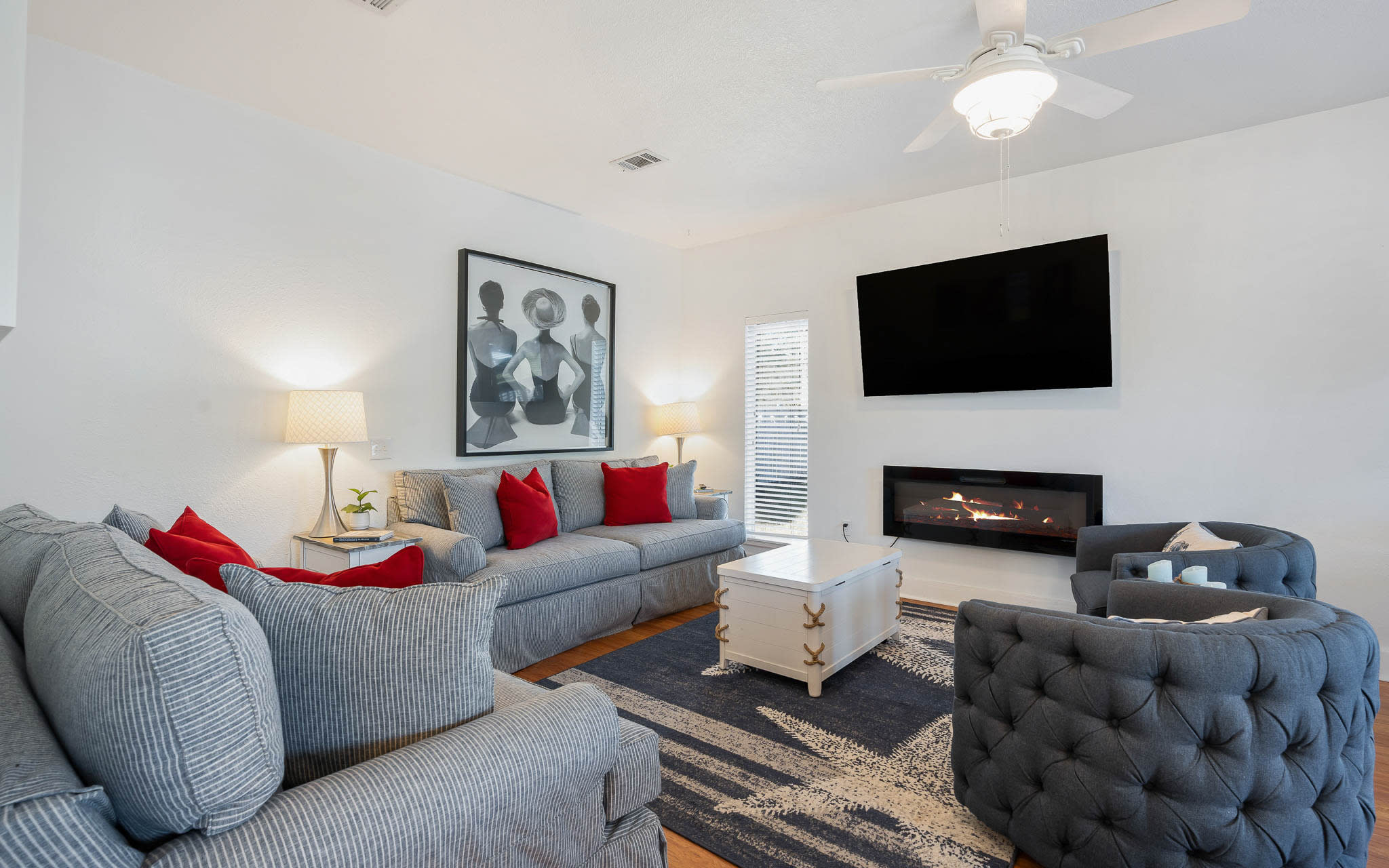 Sink into plush sectional seating while the fireplace crackles warmly. Your stylish retreat features modern comfort with thoughtful touches.