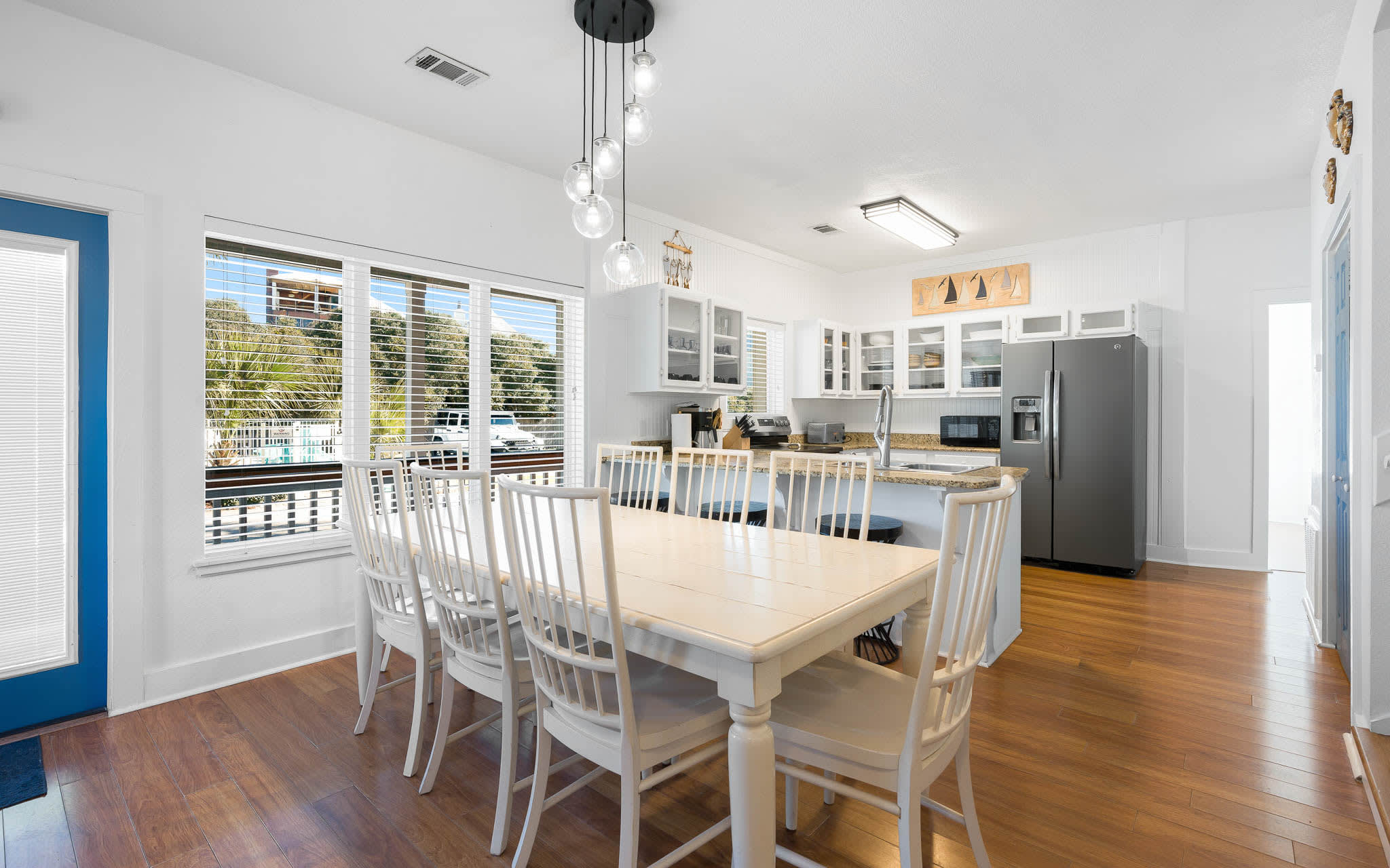 Your spacious dining area opens to a fully equipped kitchen, perfect for family gatherings and meal prep.