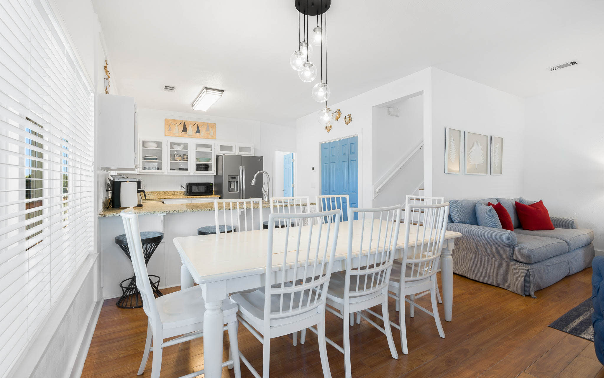Relax in this bright, open-plan living space where you can cook, dine and unwind together under stylish pendant lights.